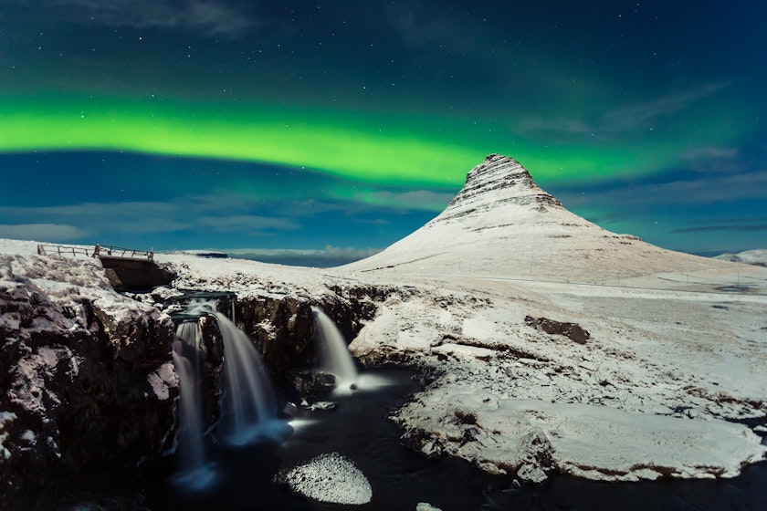 Northern Lights over Kirkjufell at the Snæfellsnes Peninsula in Iceland. 