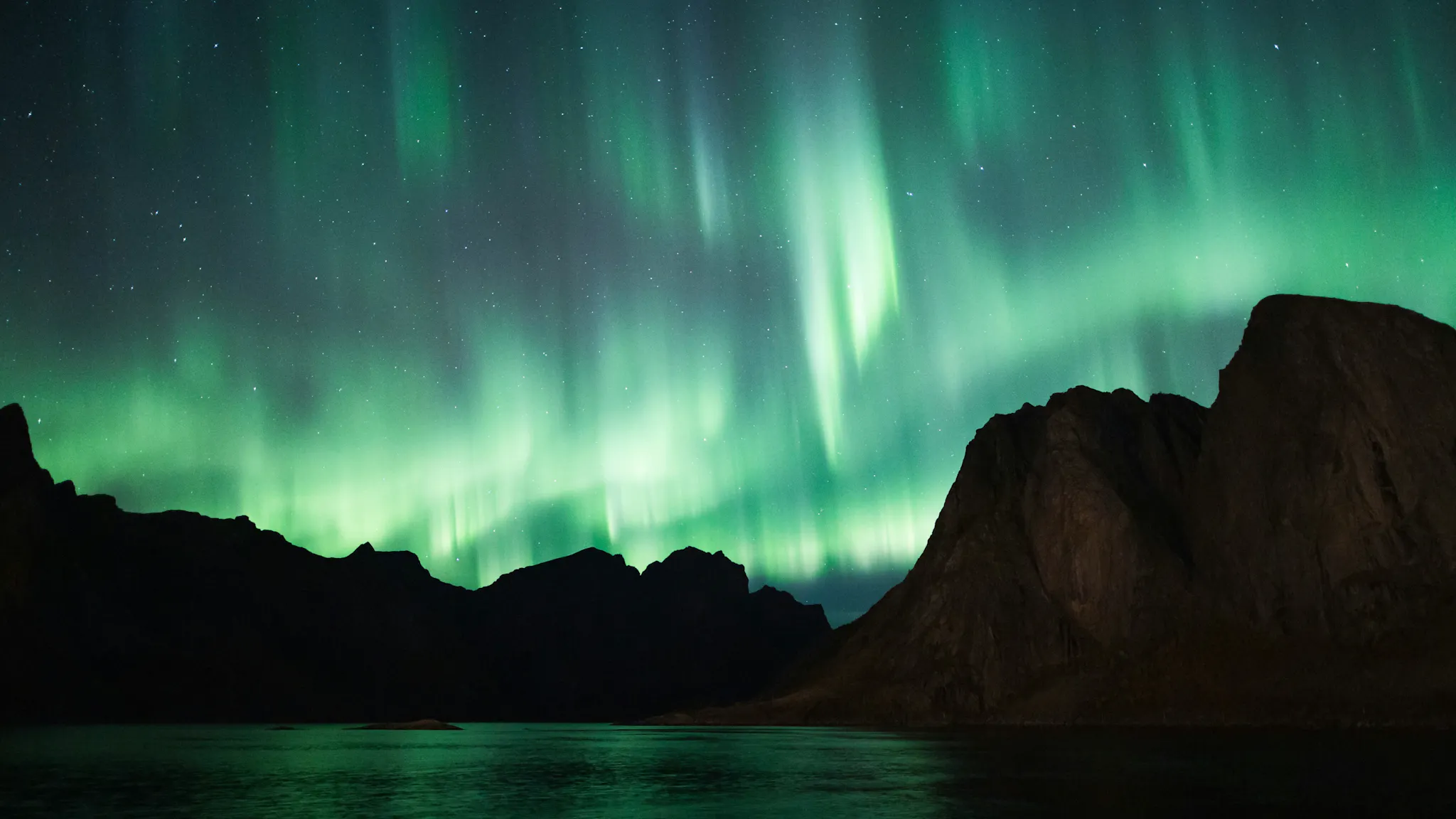 Beautiful Aurora Borealis dancing in the sky. Photo by Sami Matias Breilin from Unsplash.