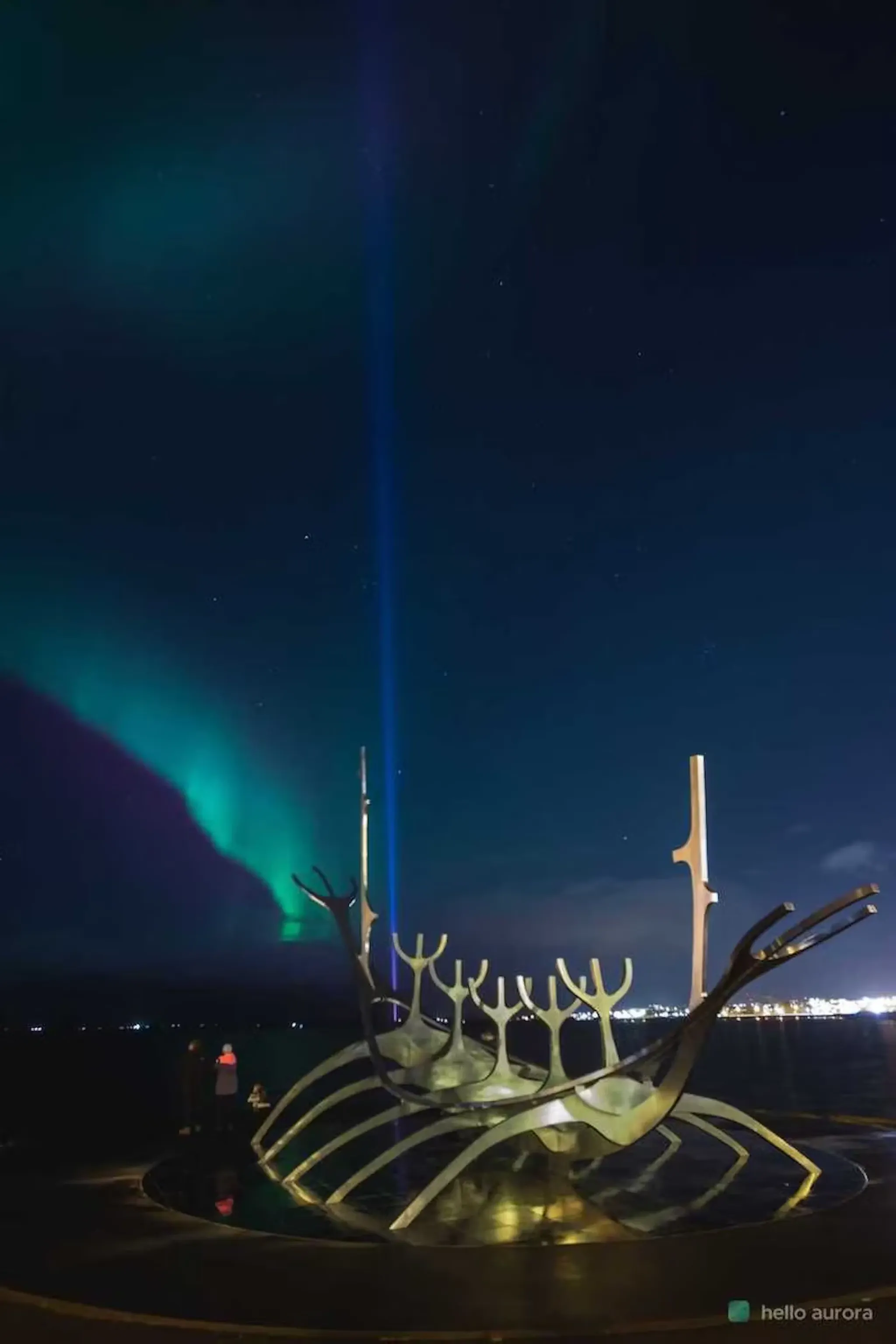 Northern Lights appear in the city despite light pollution around.