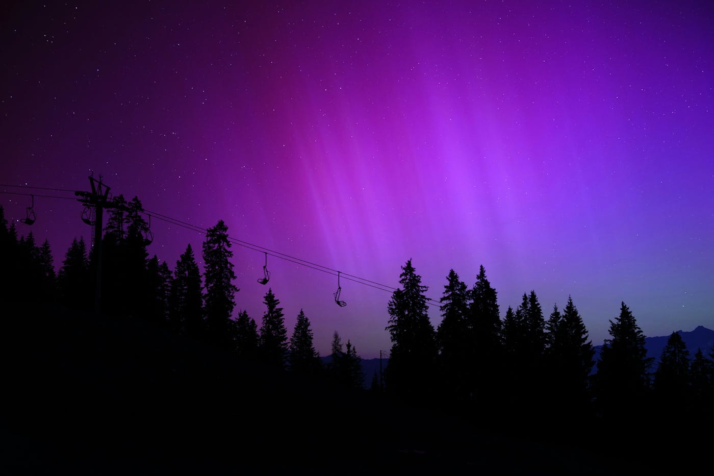 Purple Aurora Borealis in Central Europe. Photo by Joshua Kettle from Unsplash.