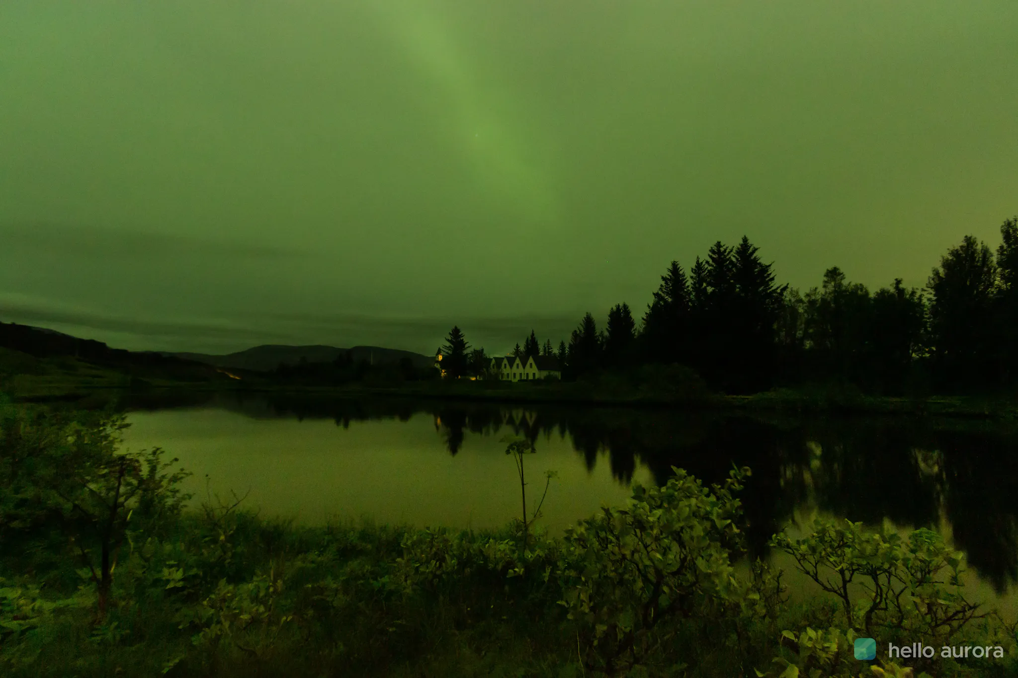 Faint Northern Lights shining through thick clouds