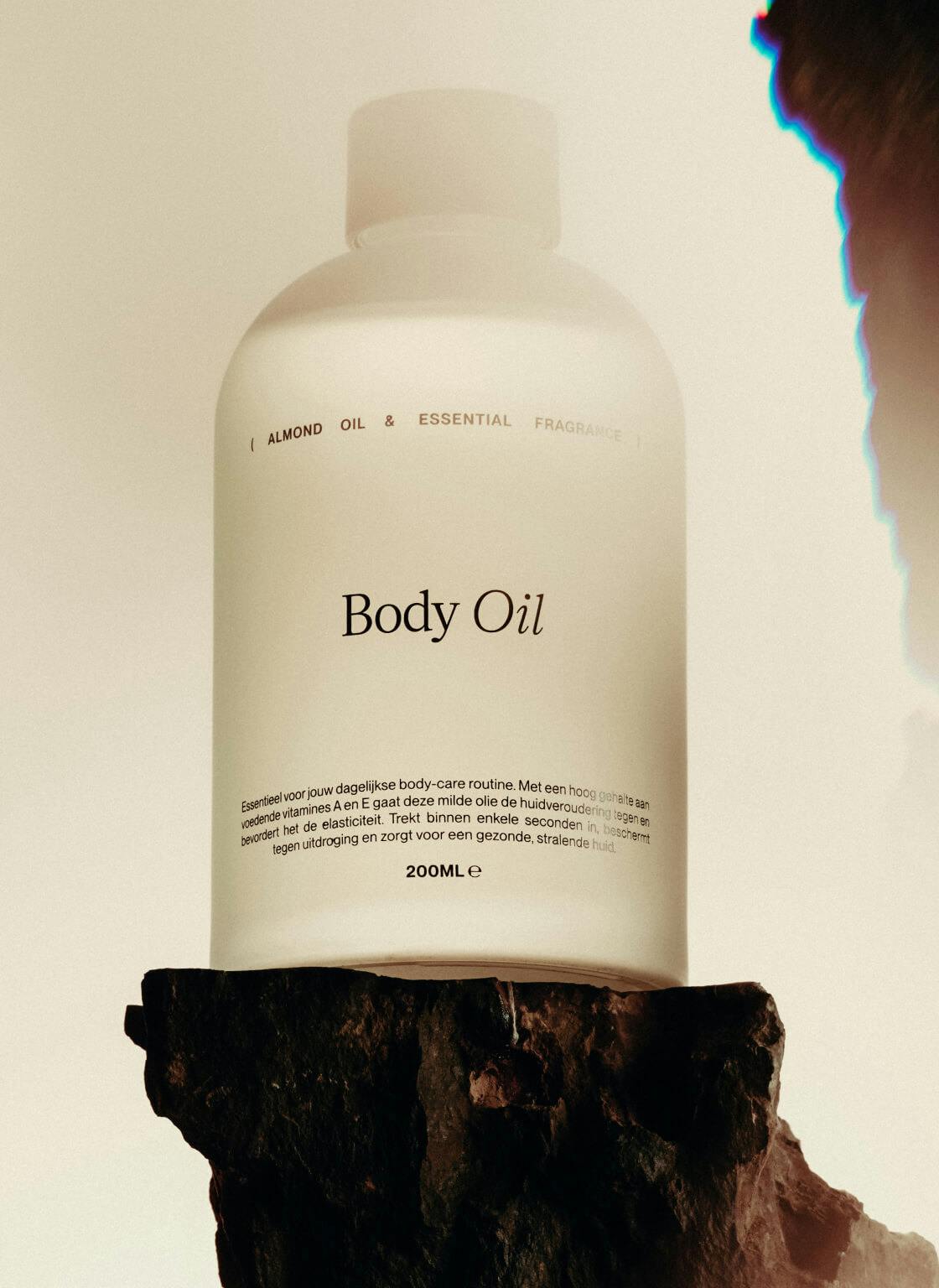 hero image of beauty product of skin oil on wooden pedestal