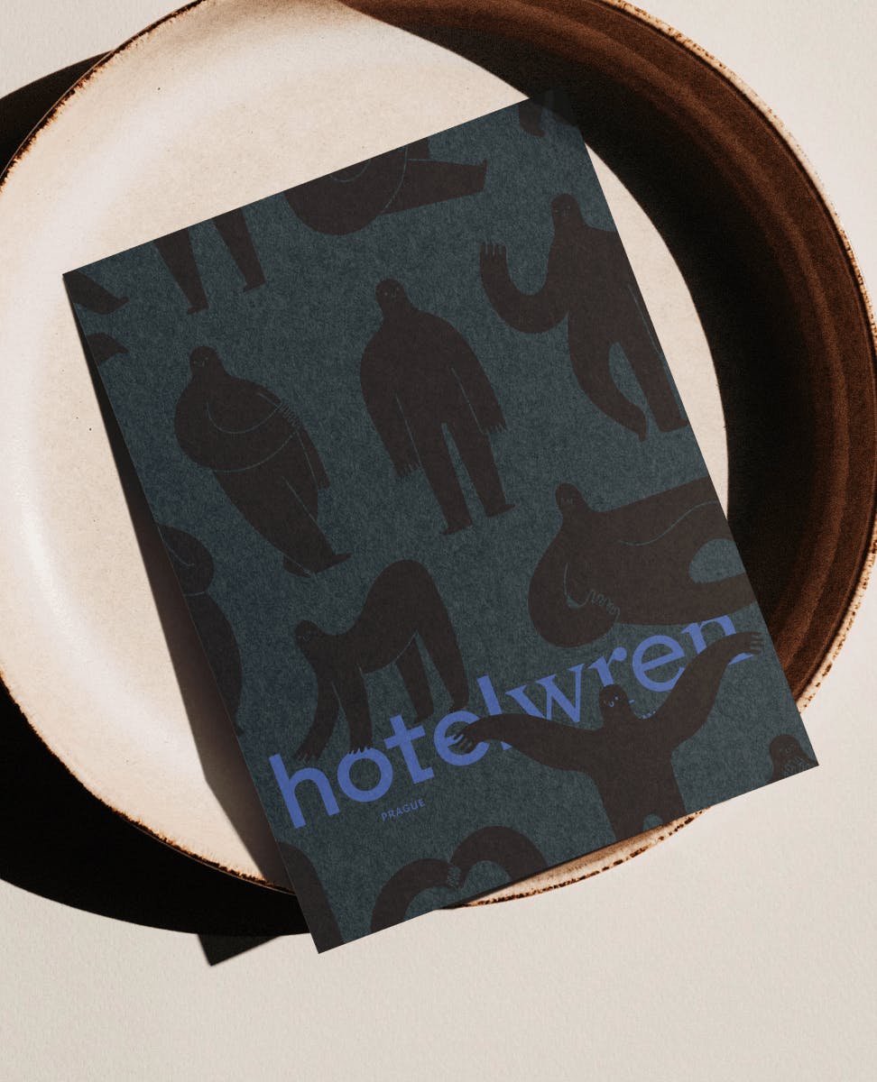 paper card with illustrations and HotelWren written on it