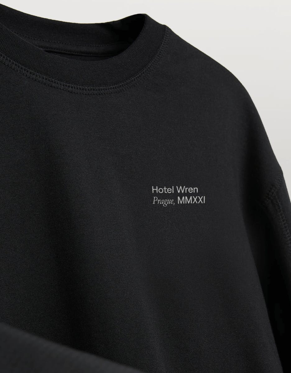 black sweatshirt with Hotel Wren written on it