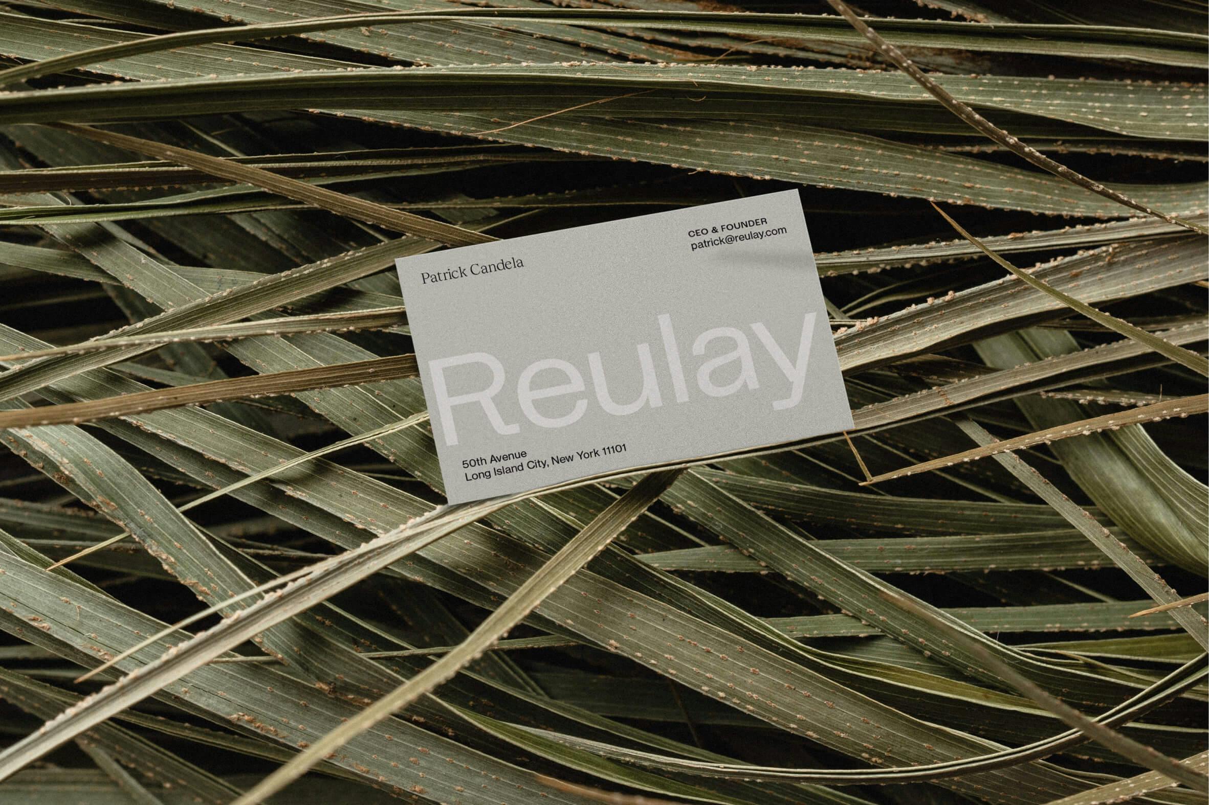 business card lying in long grass