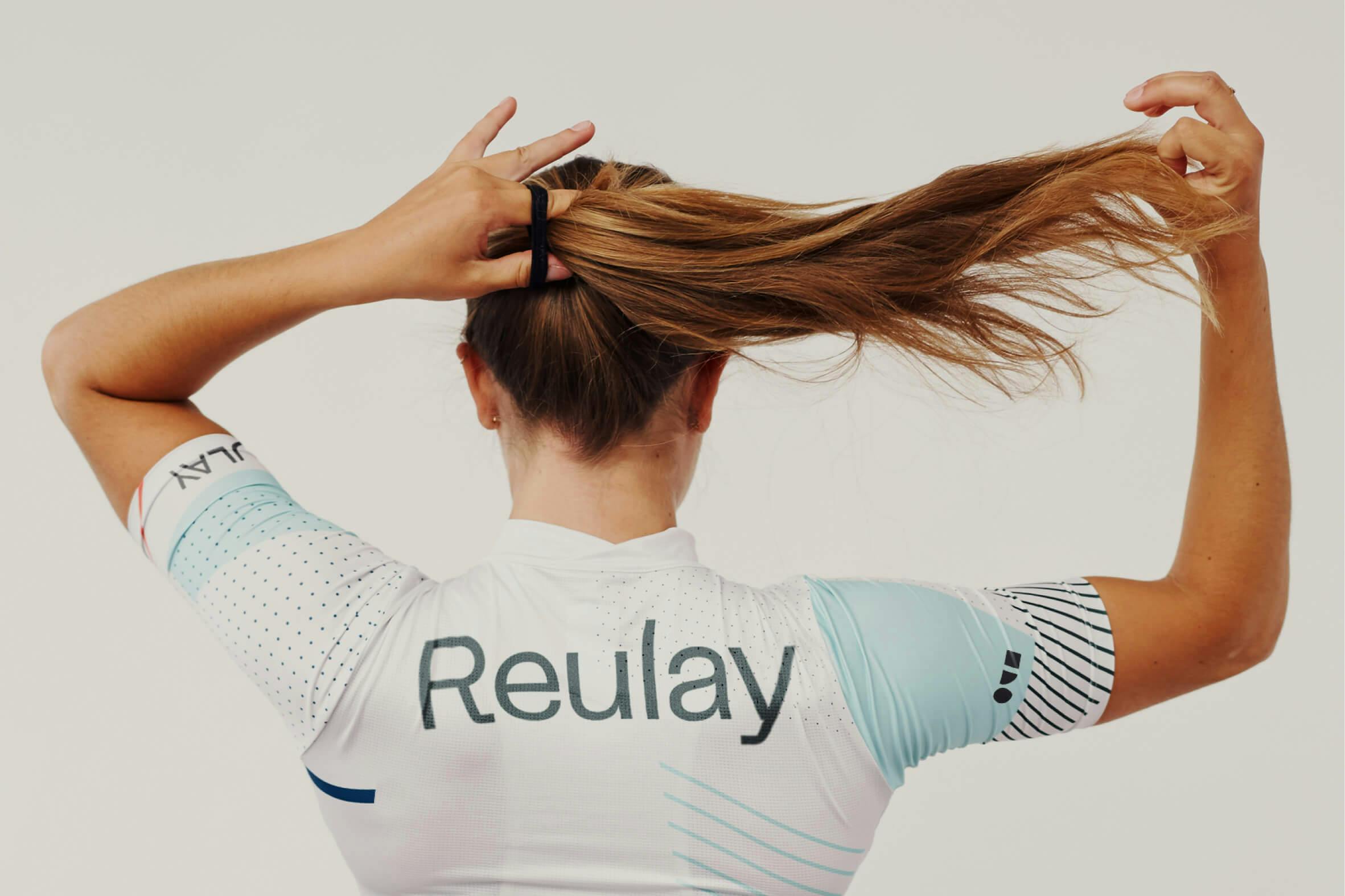 woman from behind wearing cycling top