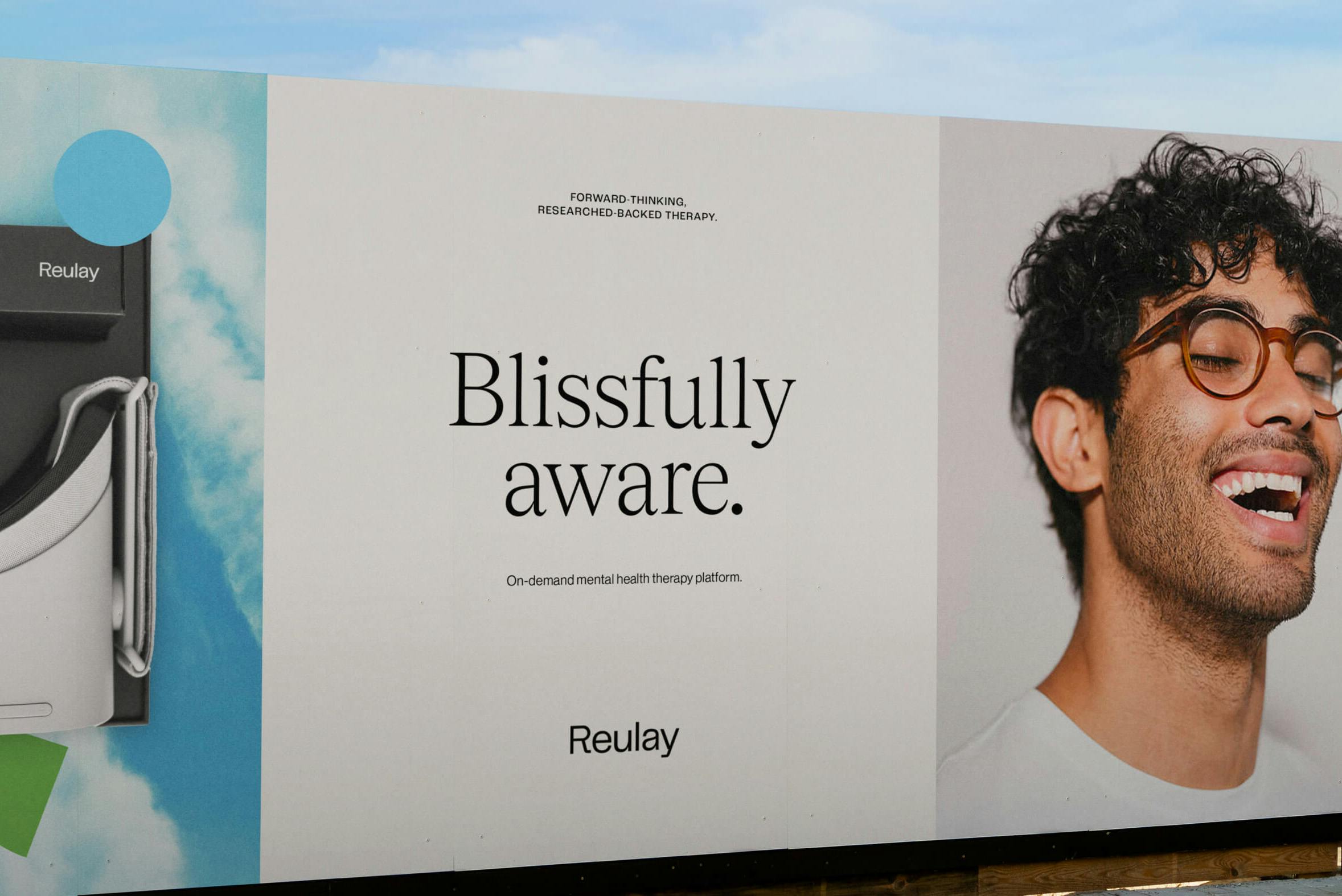 billboard showing man smiling