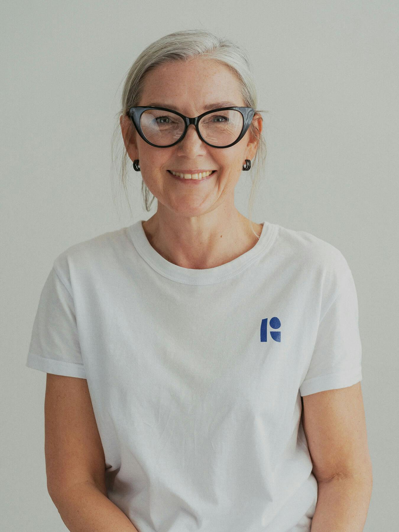 woman wearing white t-shirt and glasses