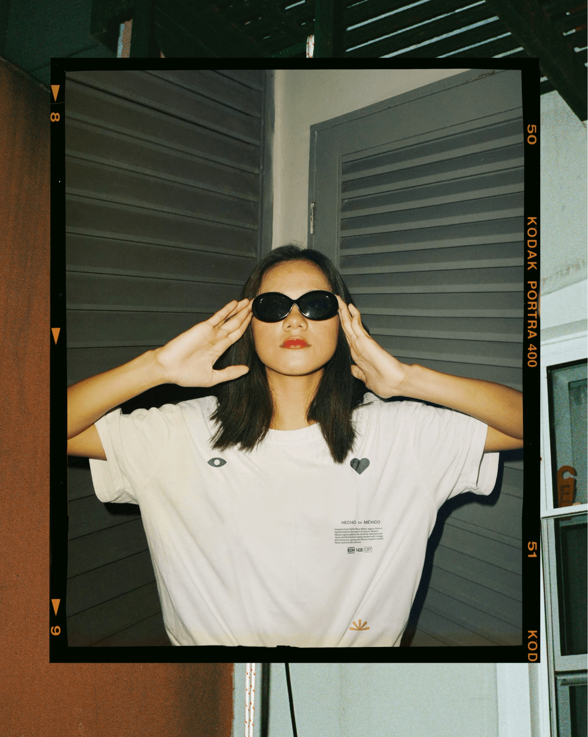 snapshot photo of girl wearing white t-shirt and sunglasses