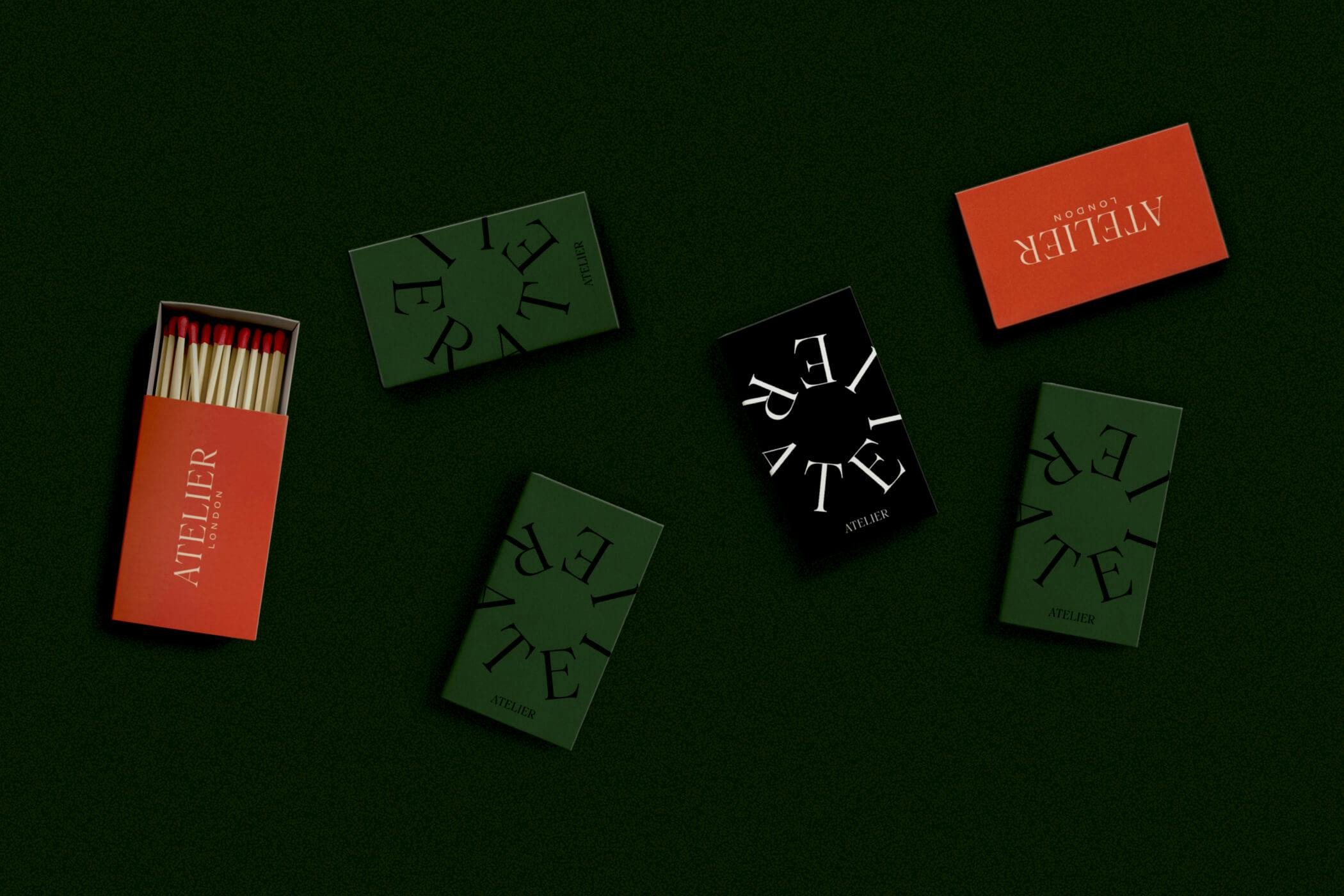 match boxes on dark green table