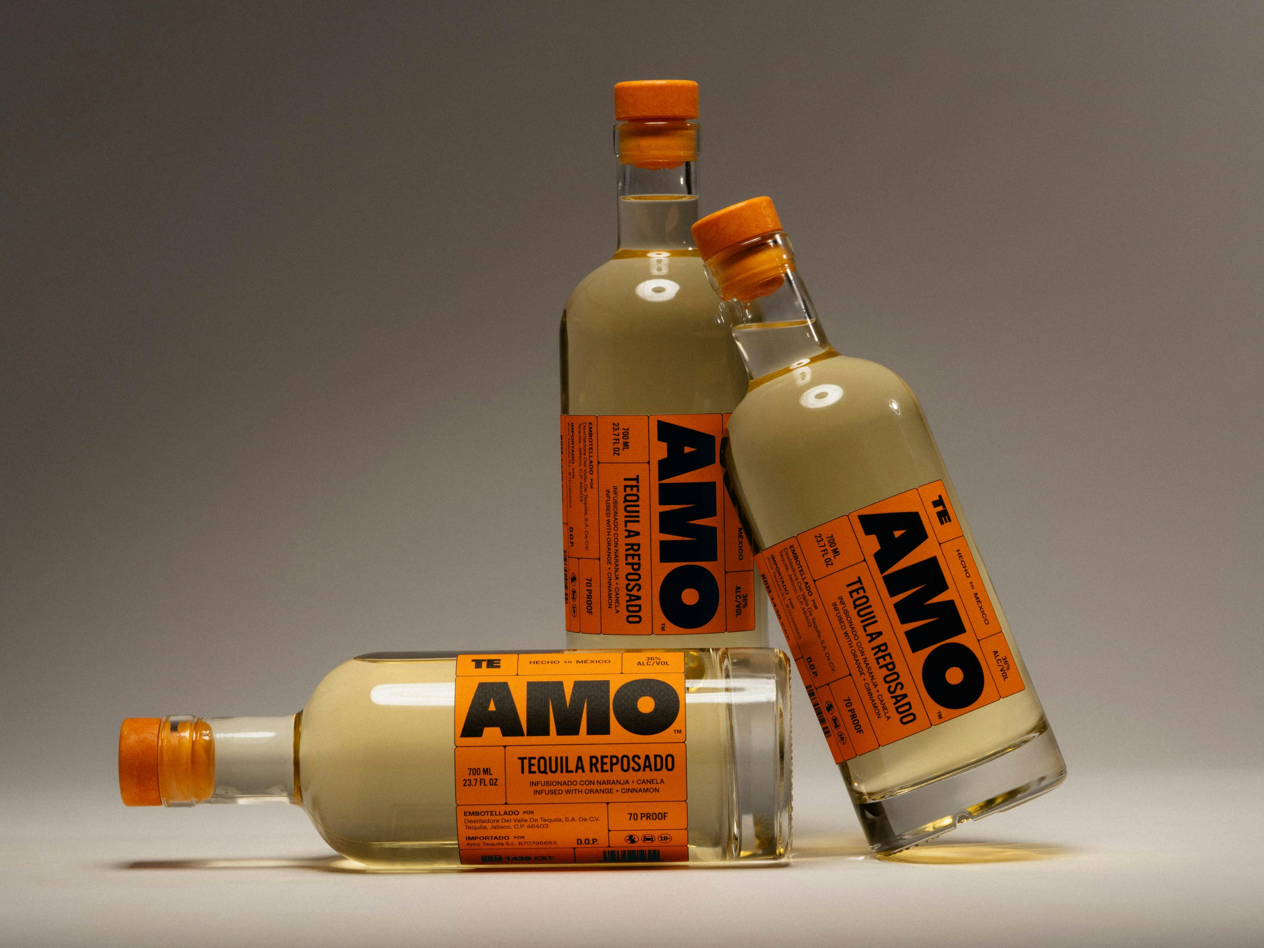 three TE AMO Tequila bottles in a studio setting