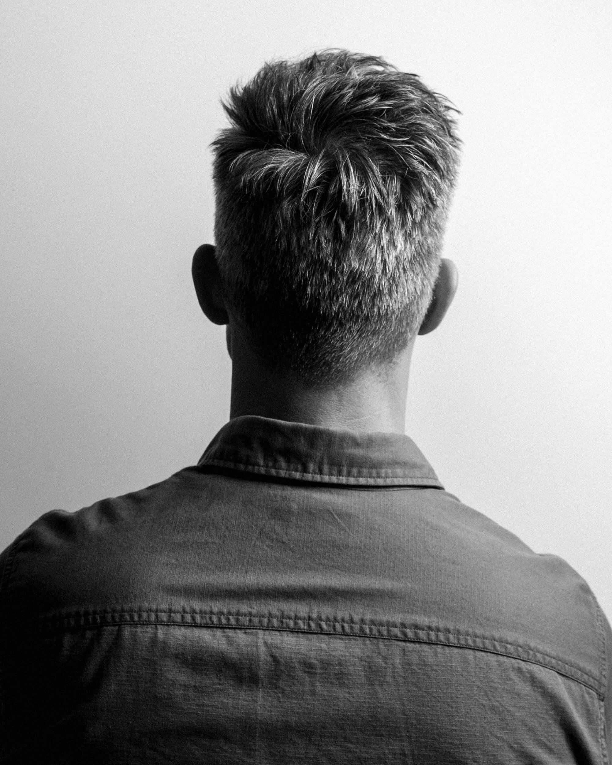 A portrait of a man from behind