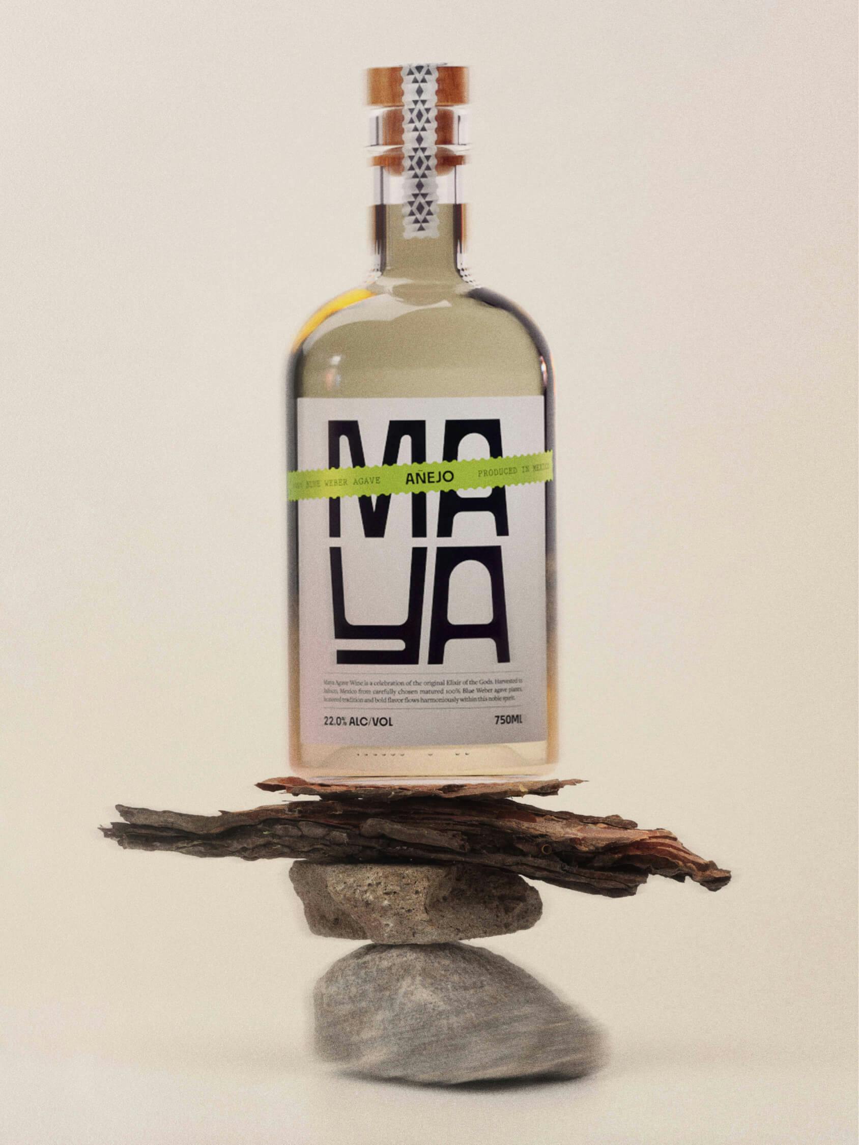 tequila bottle sitting on wood and stone still life sculpture