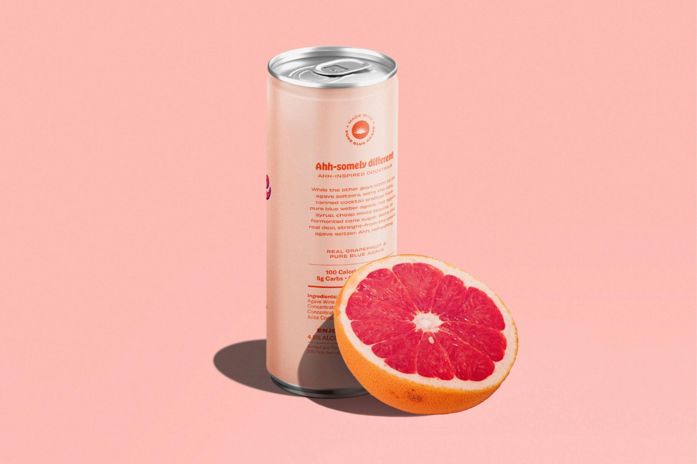 canned beverage next to grapefruit