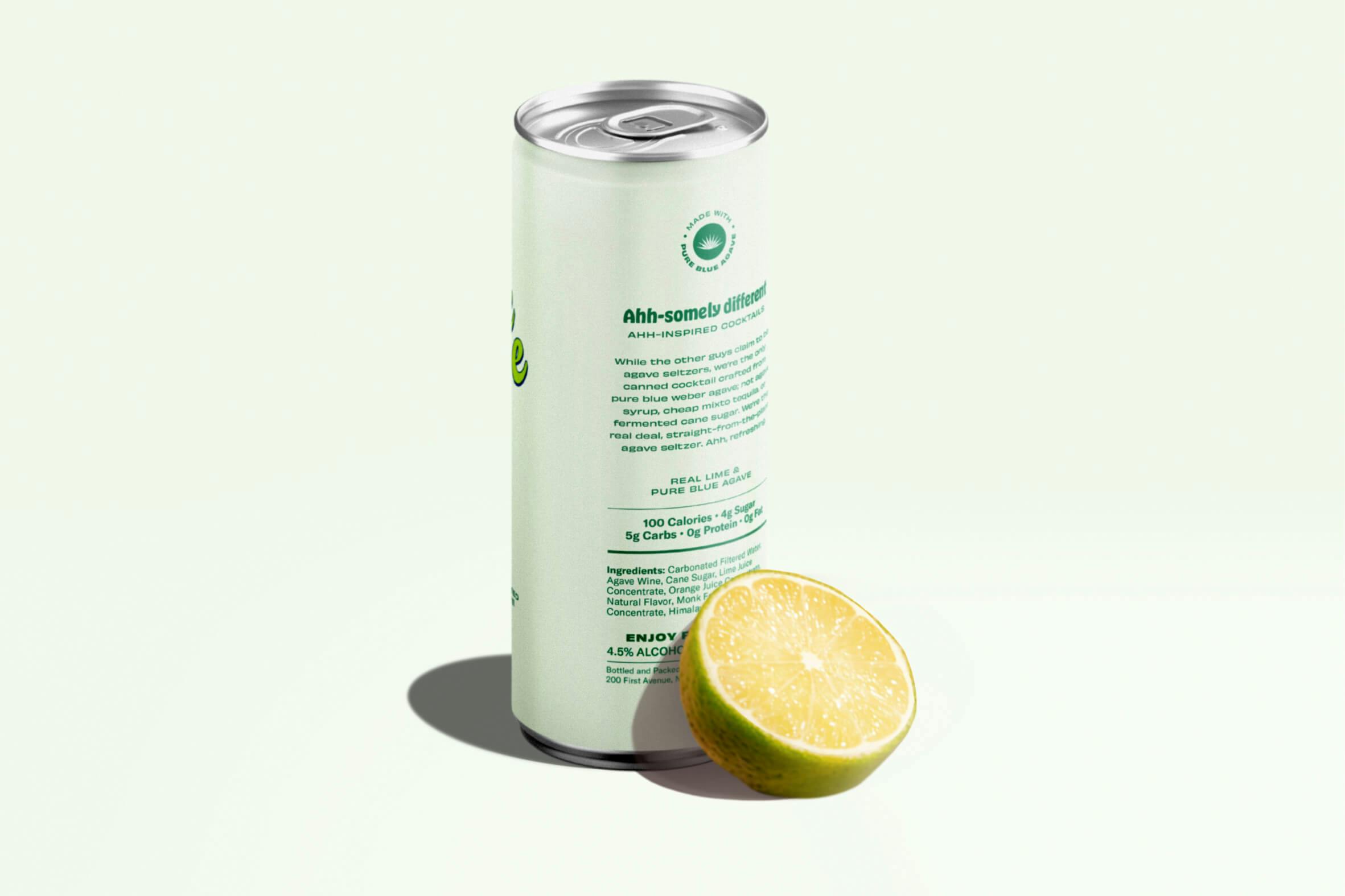 beverage in can next to lime