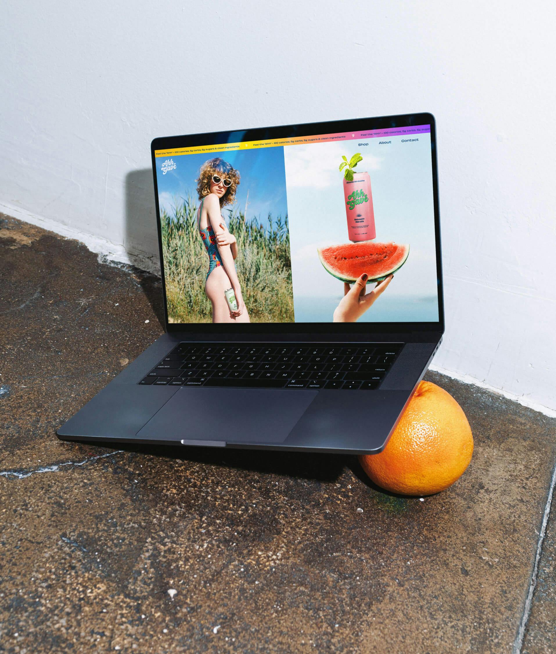 computer sitting on grapefuit