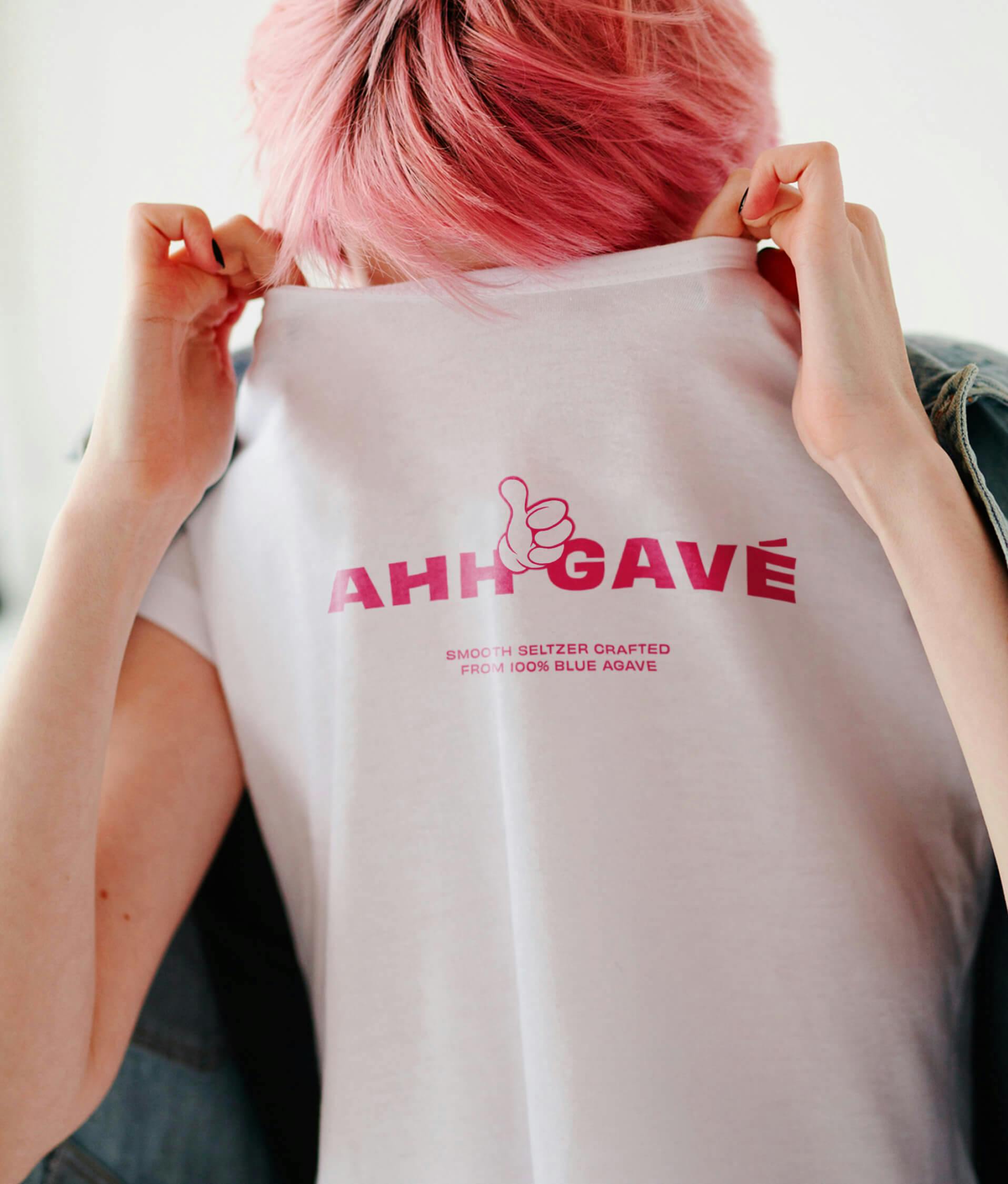 woman holding her t-shirt over her face