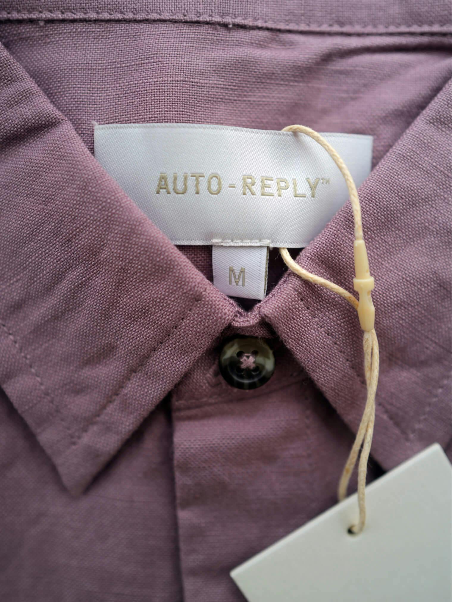 collared shirt with tag attached