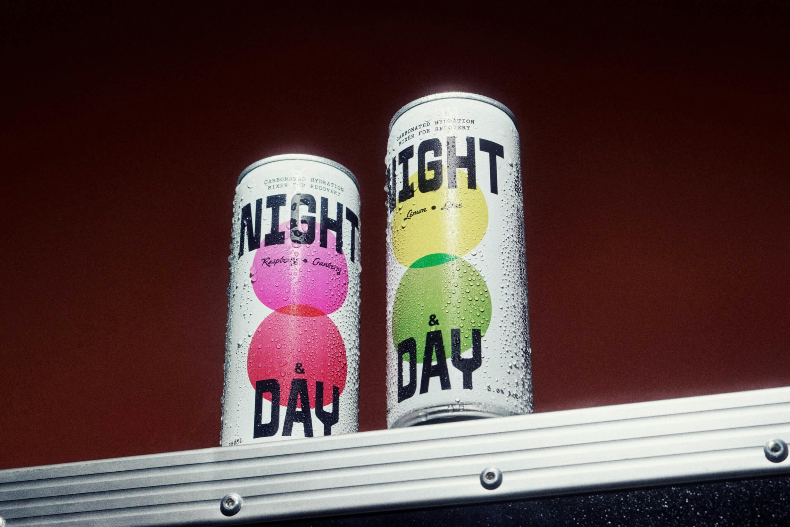 two canned beverages on silver box