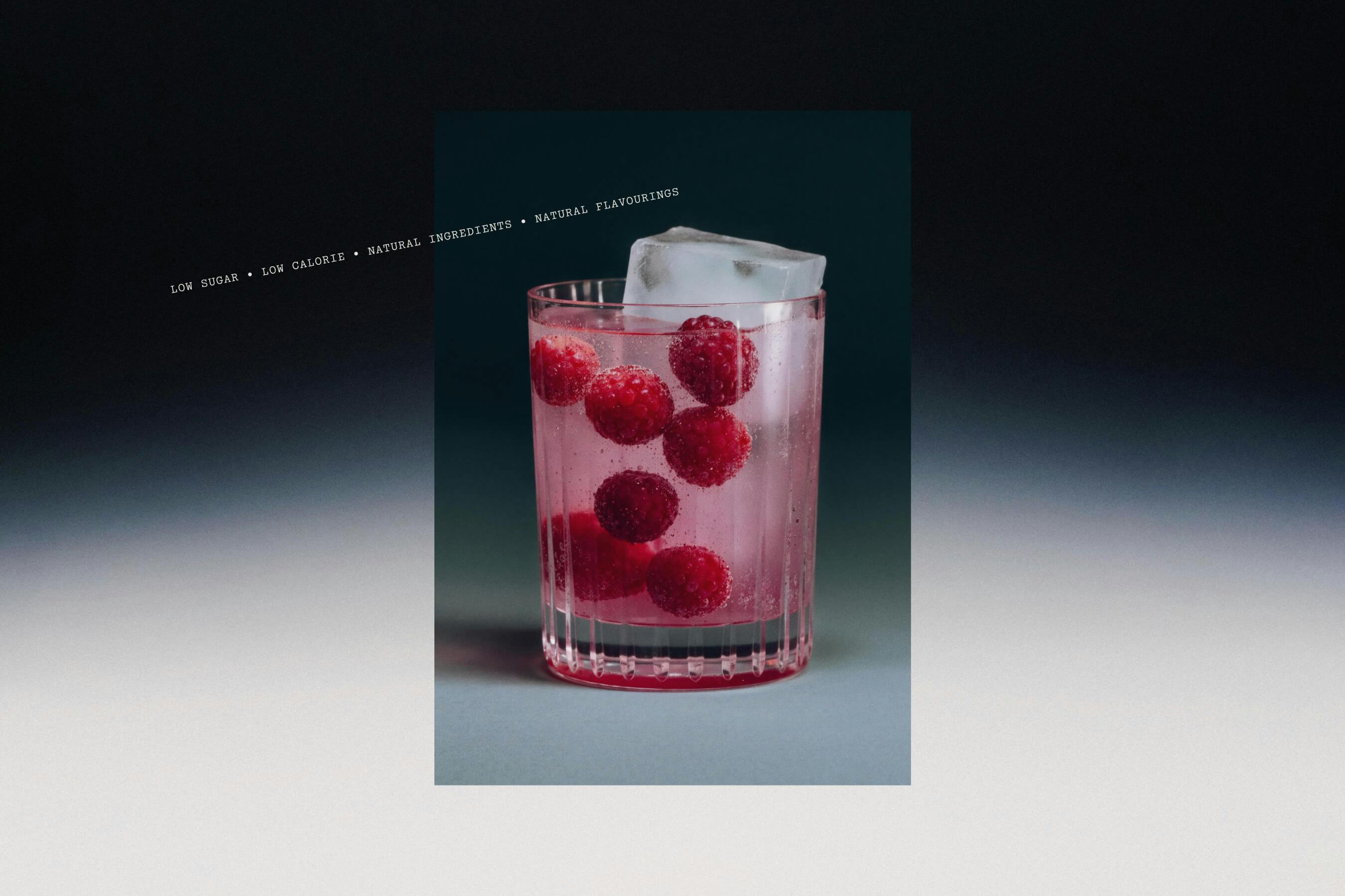 cocktail glass with raspberries