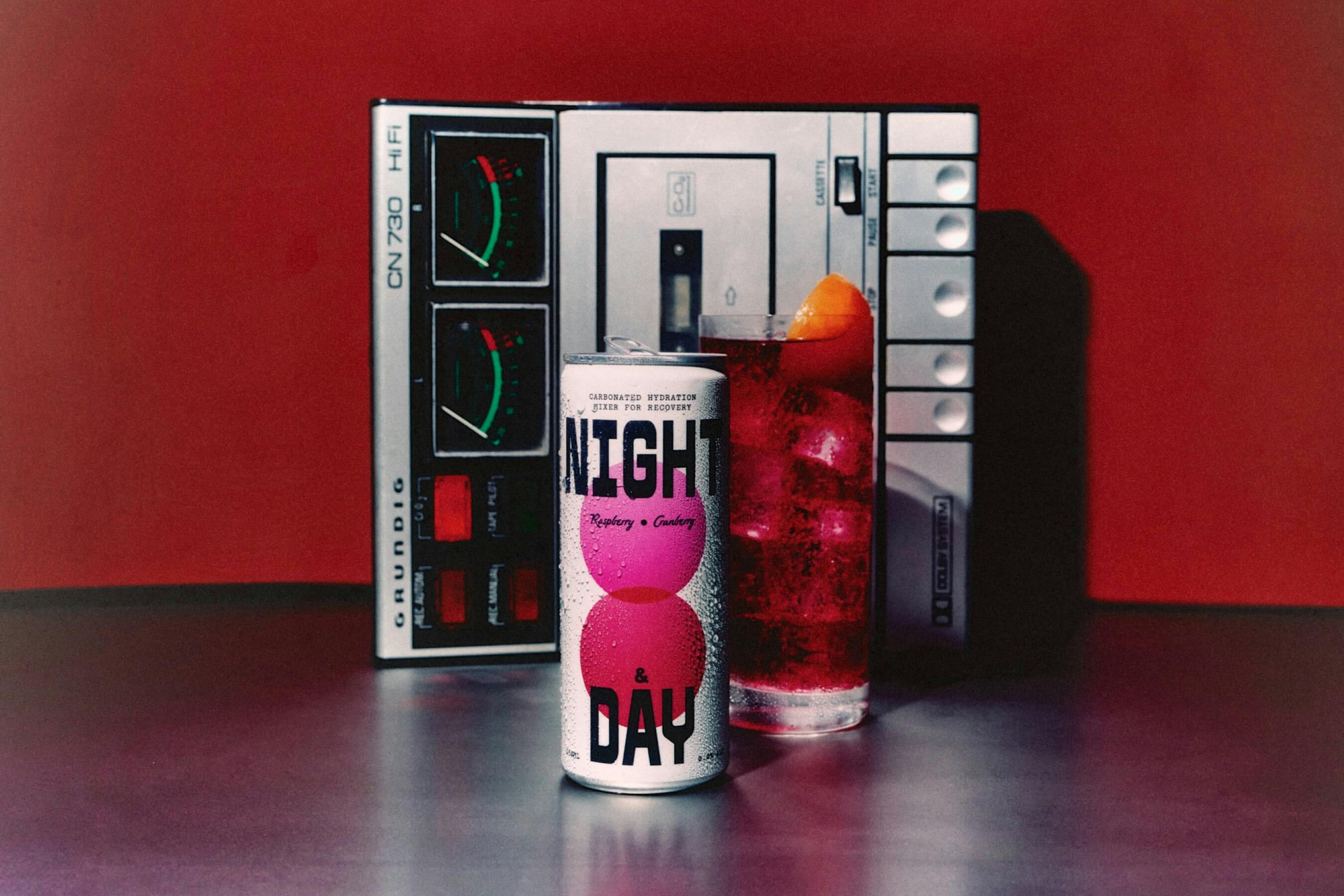 canned beverage in front of tape player