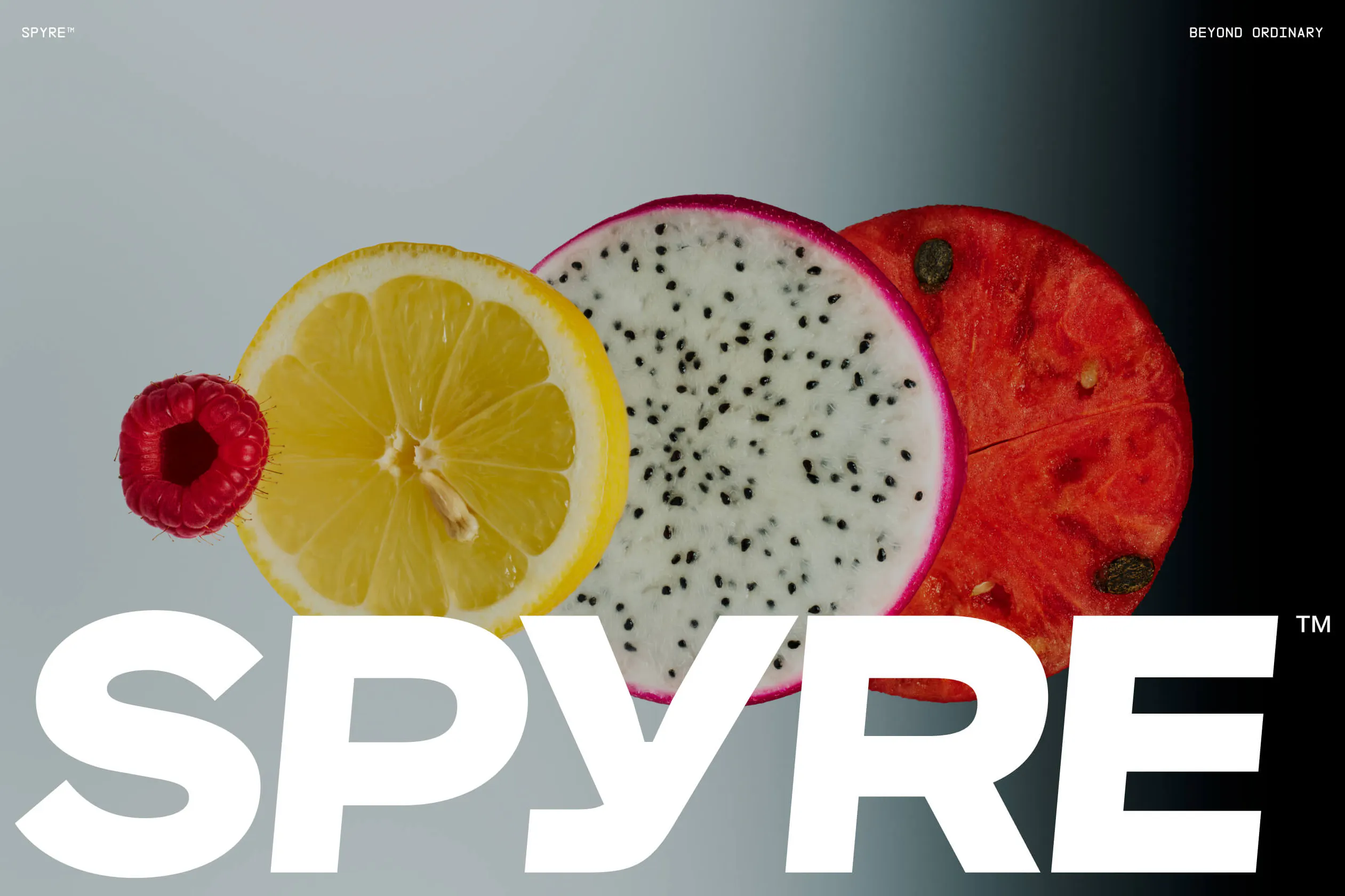 SPYRE website hero image with large wordmark set against cross-sections of fresh fruits—lemon, dragonfruit, and watermelon—fading from light grey to black
