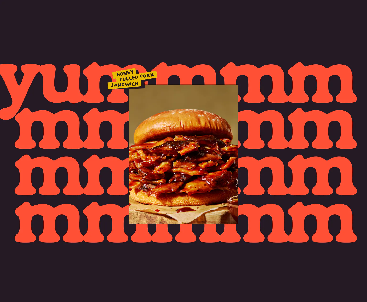 Deep purple background covered in a repeating pattern of the word "yummmm" in large red rounded type. A photo of a honey pulled pork sandwich is placed at center, with a yellow label reading "Honey Pulled Pork Sandwich."