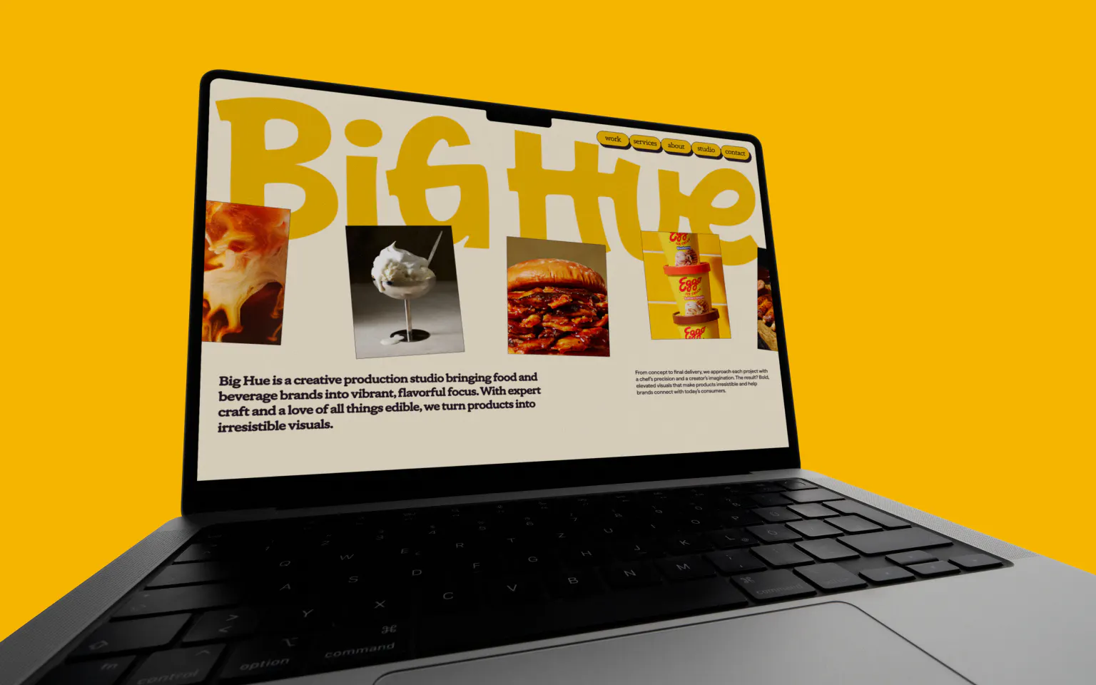 Big Hue website displayed on a MacBook against a solid yellow background. The homepage shows the oversized Big Hue wordmark above a photo grid of food imagery. Body copy reads: "Big Hue is a creative production studio bringing food and beverage brands into vibrant, flavorful focus."