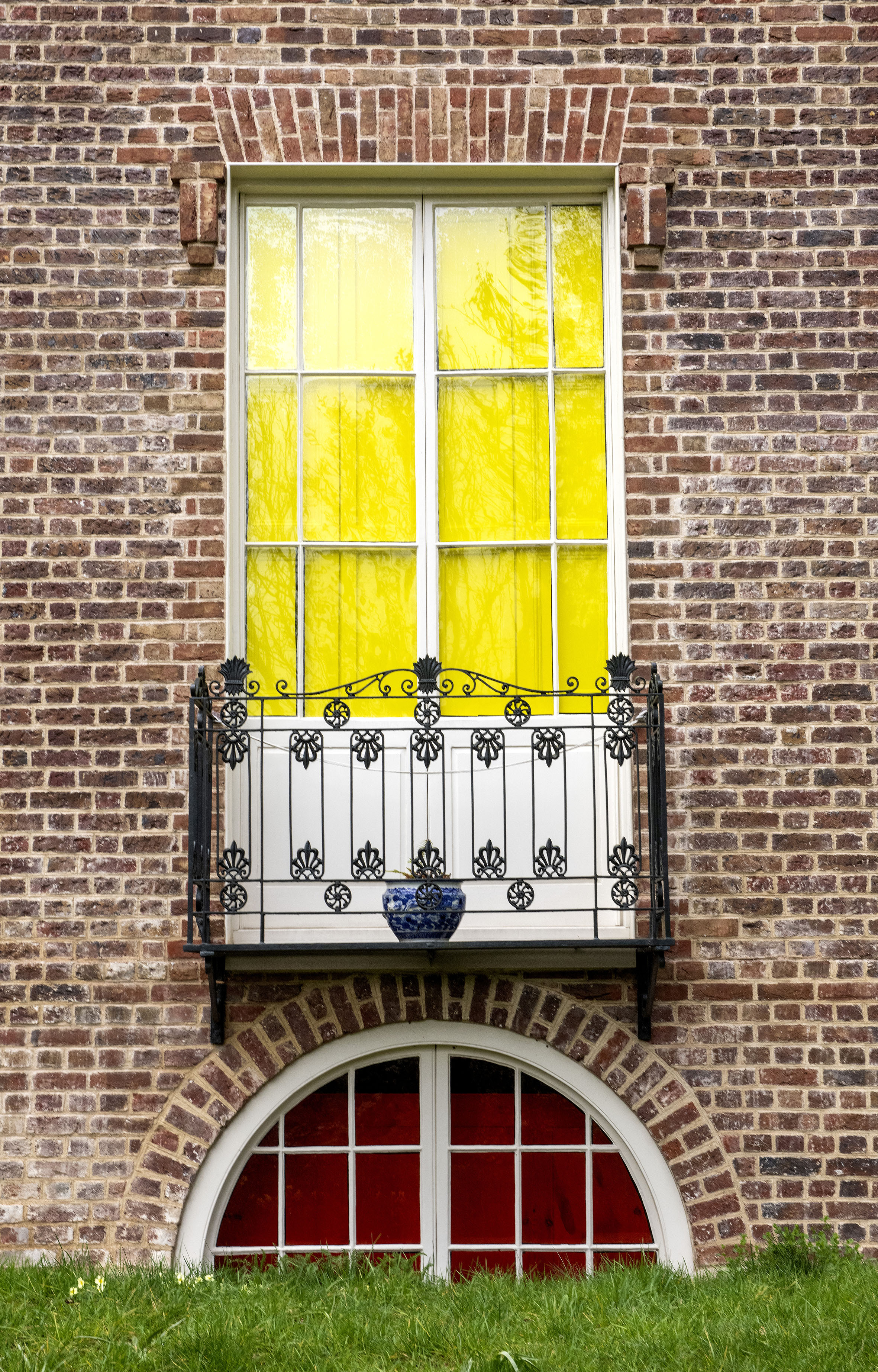 The effects', Sculptural installation by artist Henry Coleman. Rear Window and balcony of  JMW Turner's House, Sandycombe Lodge colored in tones of yellow, surrounded by detailed brickwork