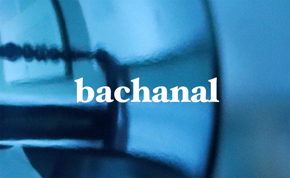  Still from the film 'Syllabus' by artist Henry Coleman based on Ai generated readings of JMW Turner's Royal Academy perspective lectures showing the word 'bachanal' against a watery blue background