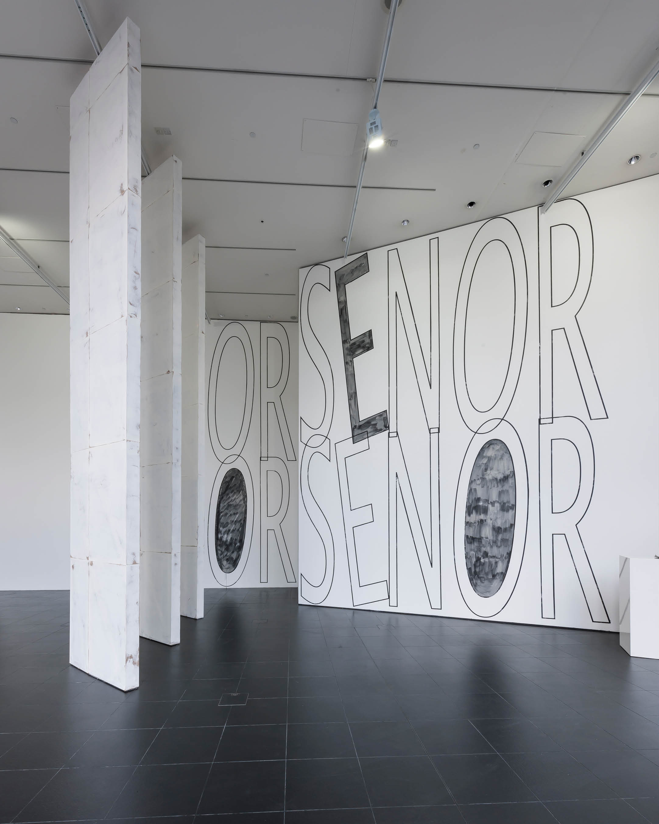 'Senor ' wall painting  by Henry Coleman at Bloomberg SPACE, overlapping letters painted in black in white spell out the words Senor Senor