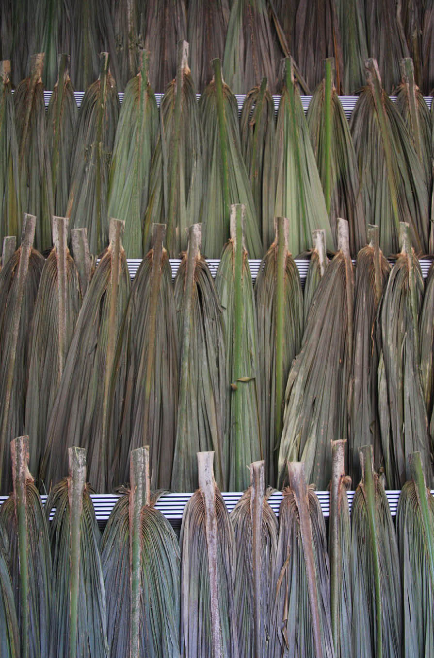 Decorated structure (productive public) by artist Henry Coleman, produced for Salon nacional de Artistas, Cartagena, Colombia, Palapa thatch is woven into a decorated white aluminum framework