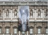 'The Greater Order', Sculptural installation by artist Henry Coleman across the Royal Academy buildings, London. Close up of  large banner with  image of the  Cast corridor of the Royal Academy schools on the facade of Burlington House 