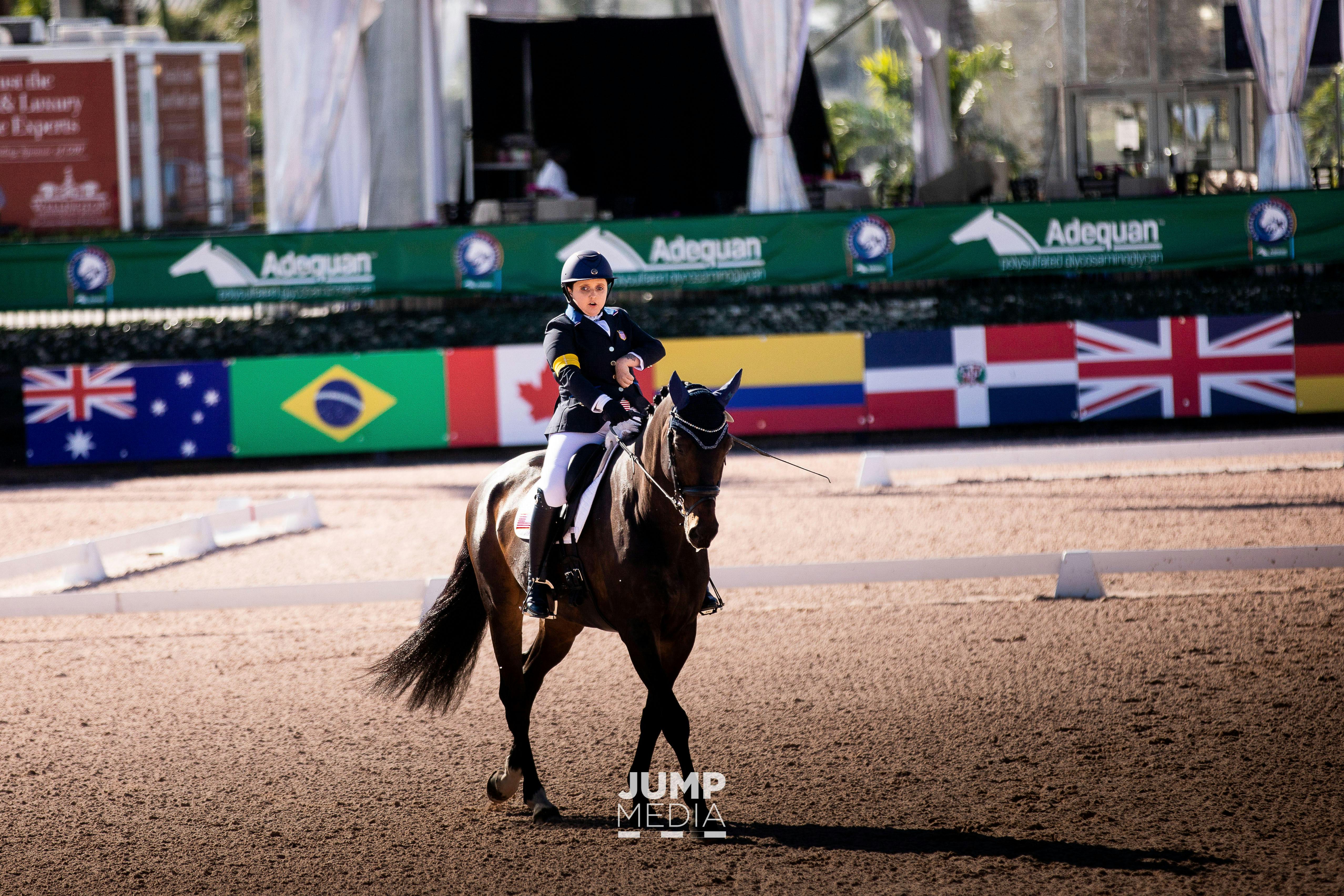 Sydney Collier riding her horse at a para equestrian competition