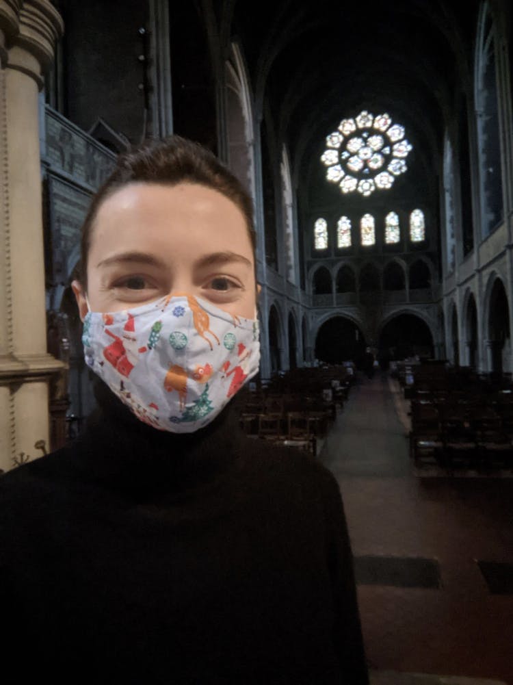 Lizzie wearing a festival mask