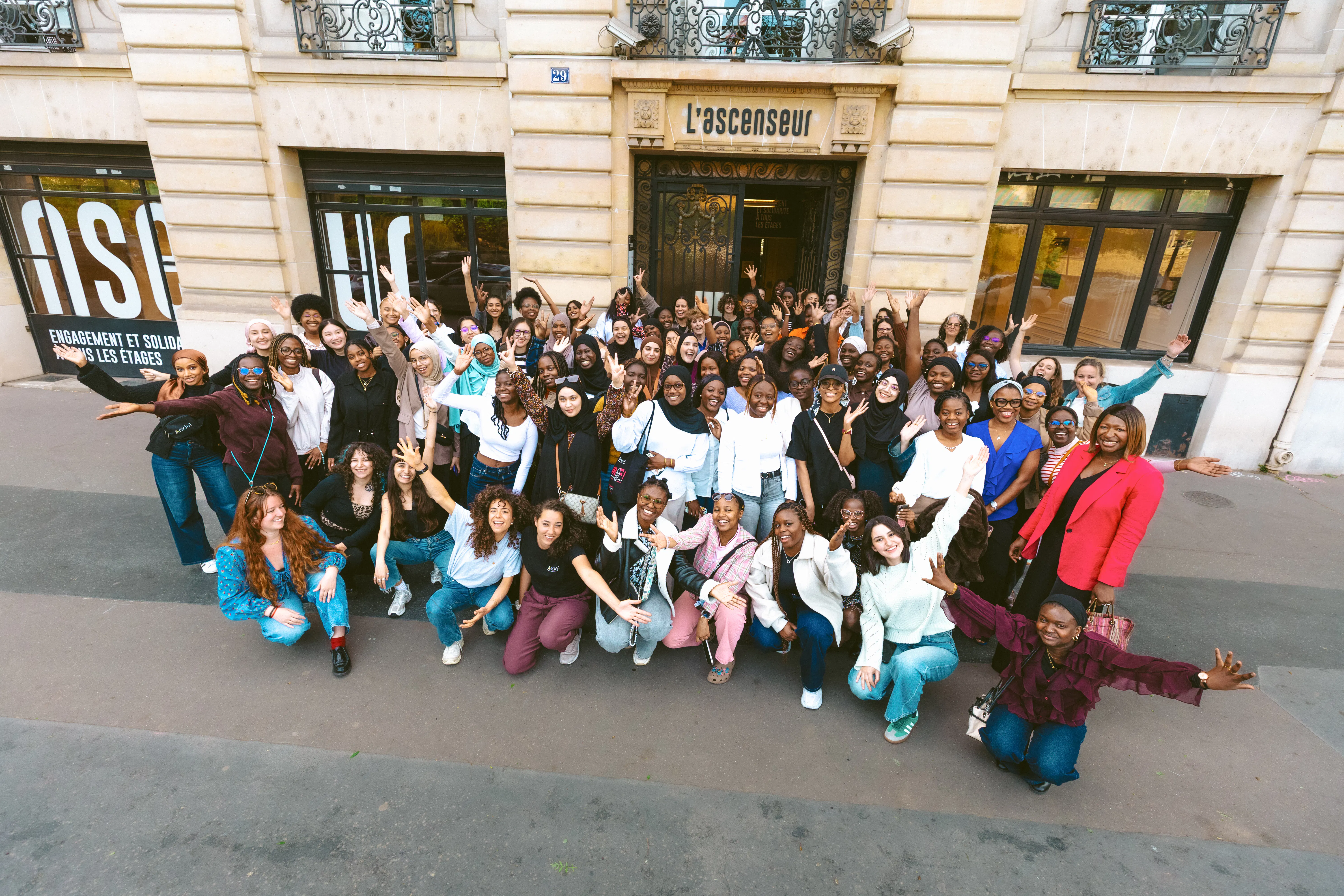 Article 1 students in a group outside an event