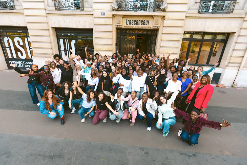 Article 1 students in a group outside an event