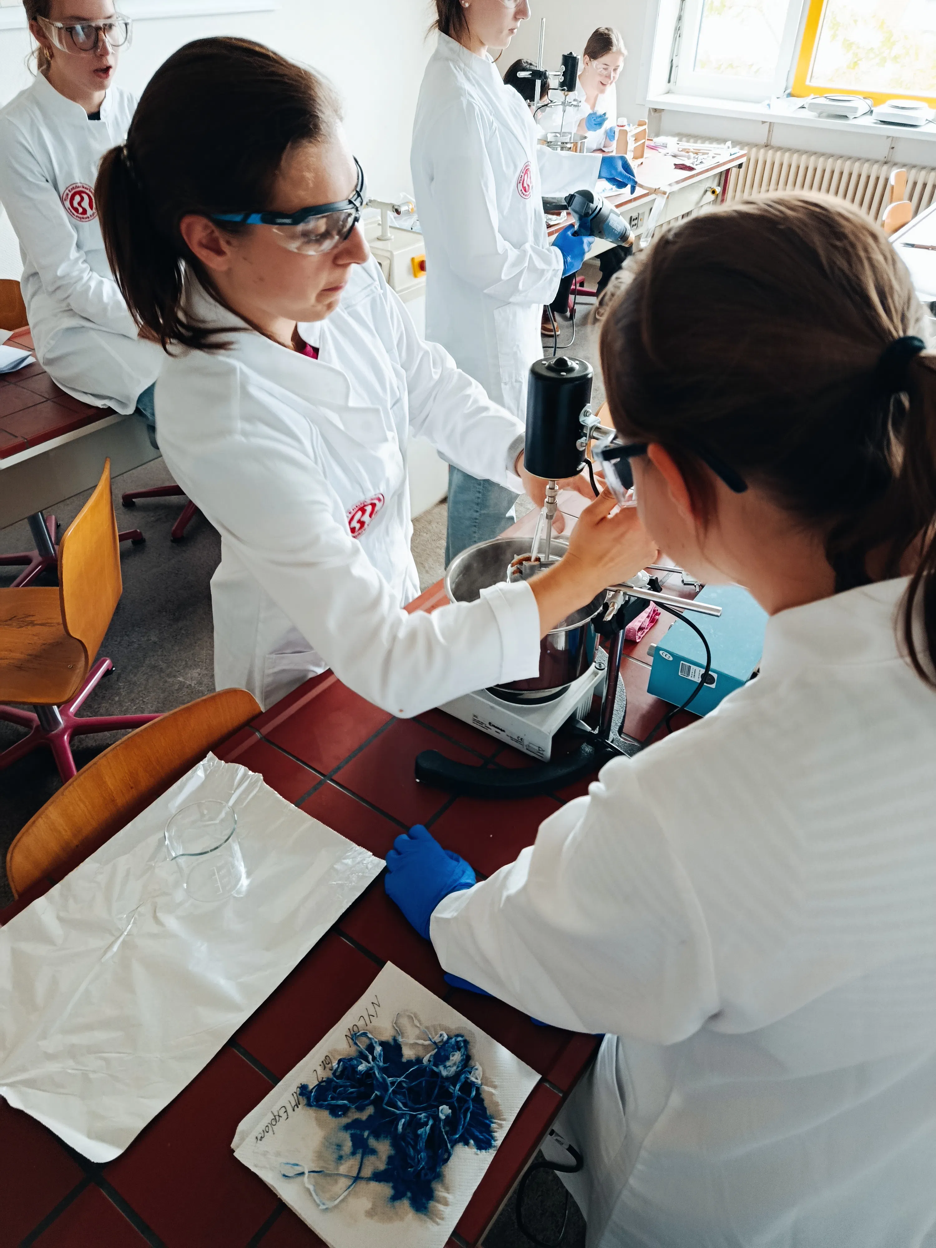 TUM programme students taking part in a lab activity