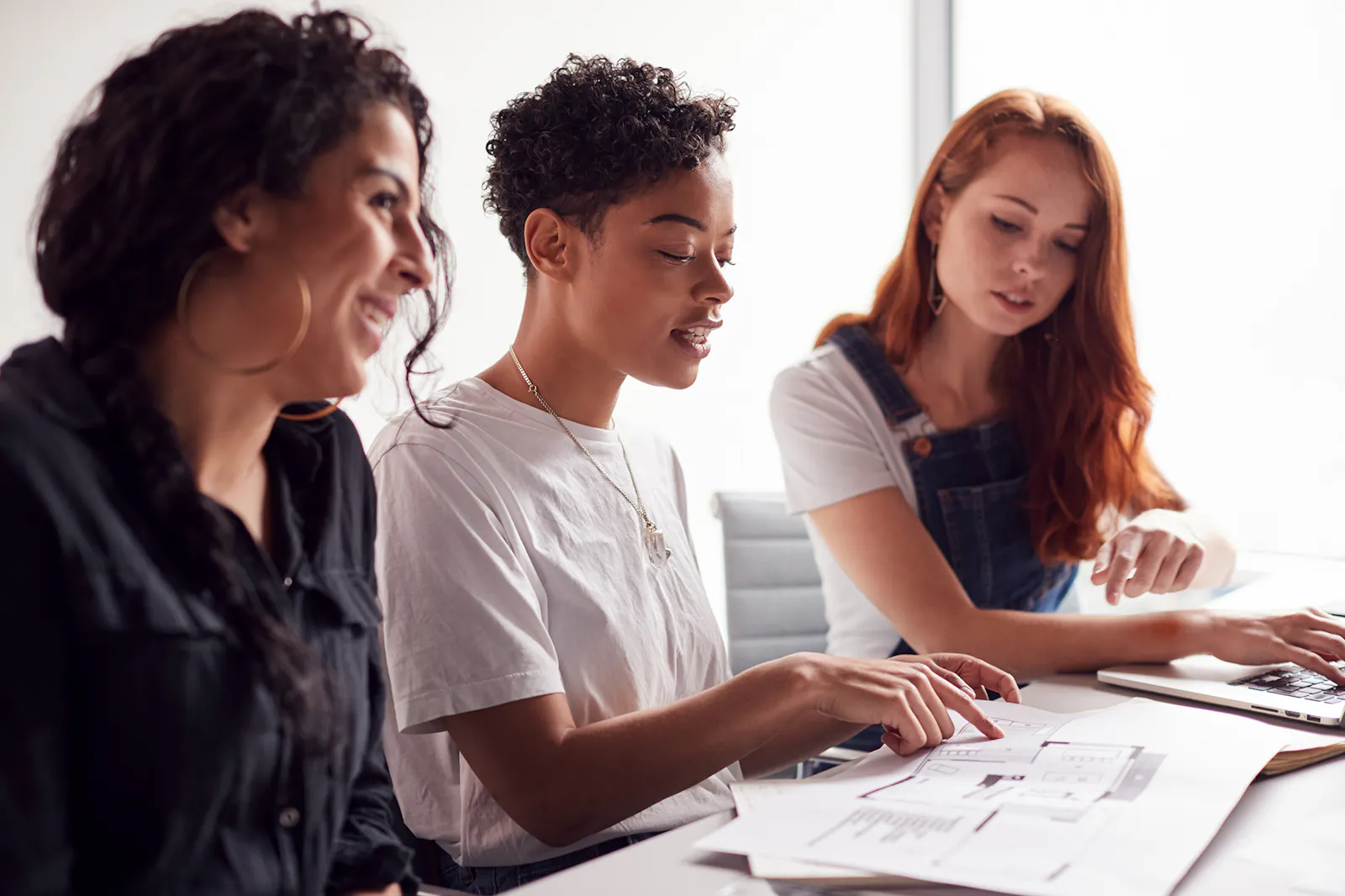Young people looking at a piece of paper