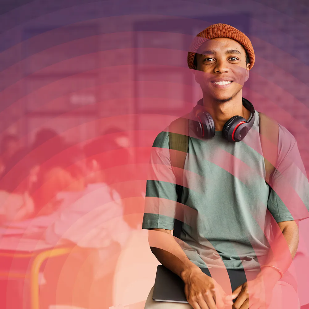 Young man wearing headphones and smiling with STEM Horizons branding overlaid