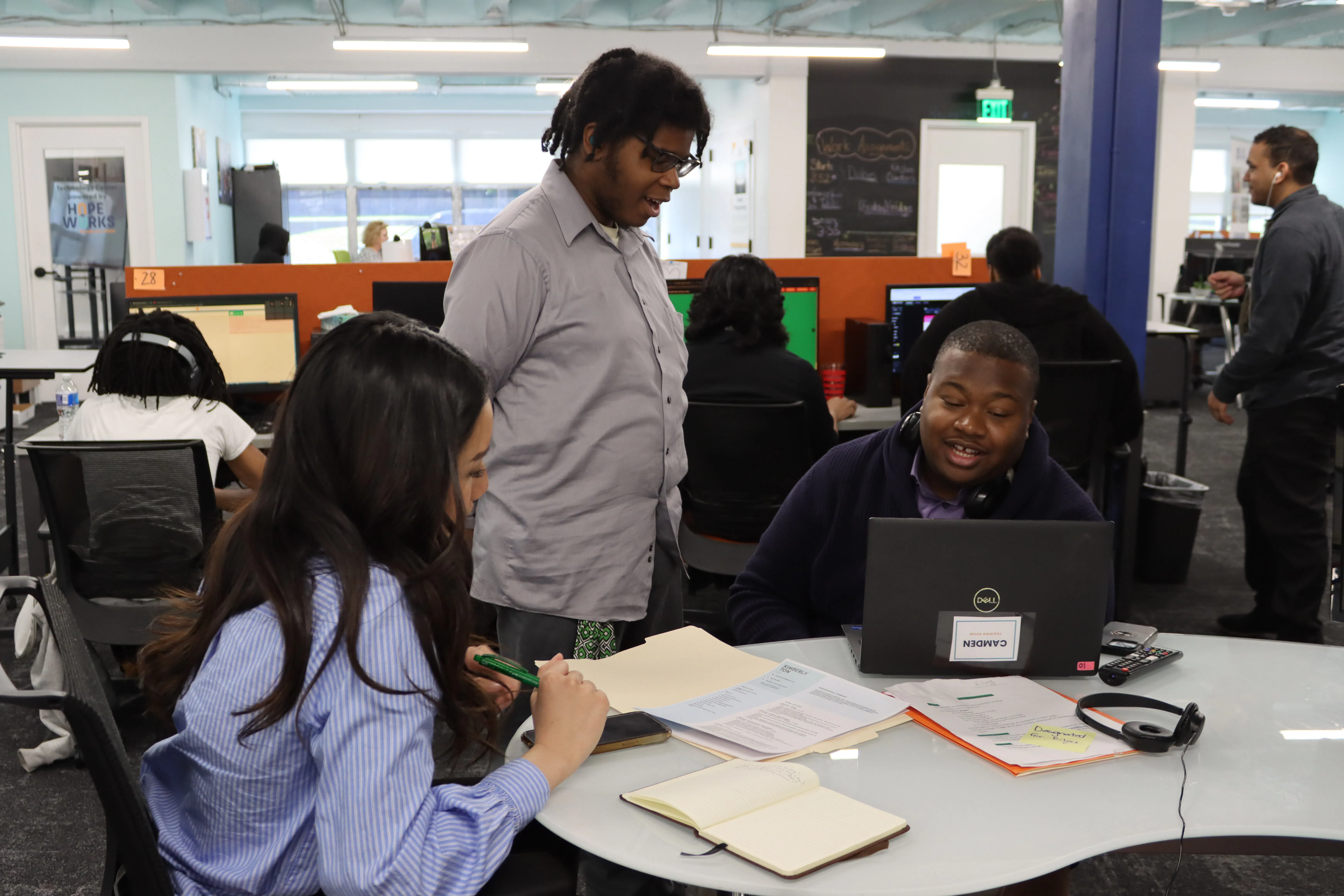 Trainees at US social enterprise Hopeworks work on a project
