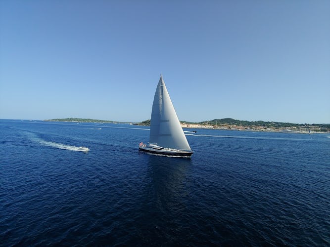 Luxury yacht sailing with sails up
