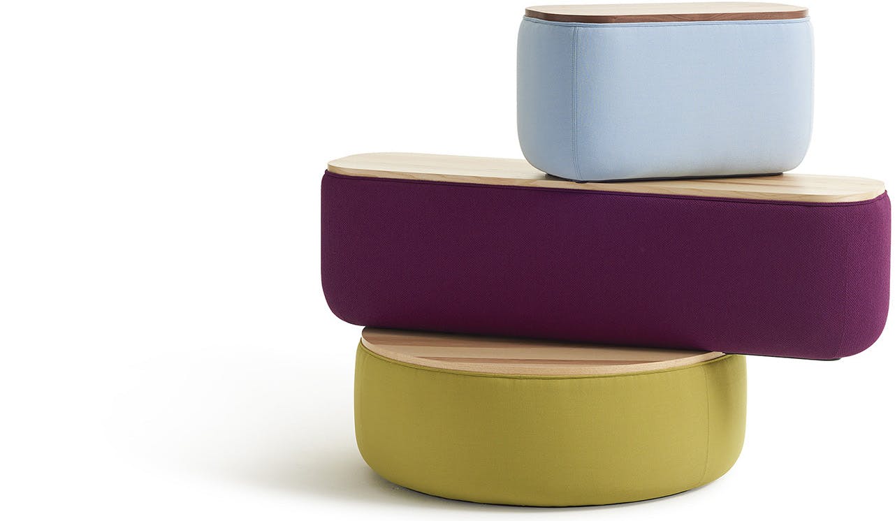 A stack of colorful Breck Benches by Most Modest and Hightower.