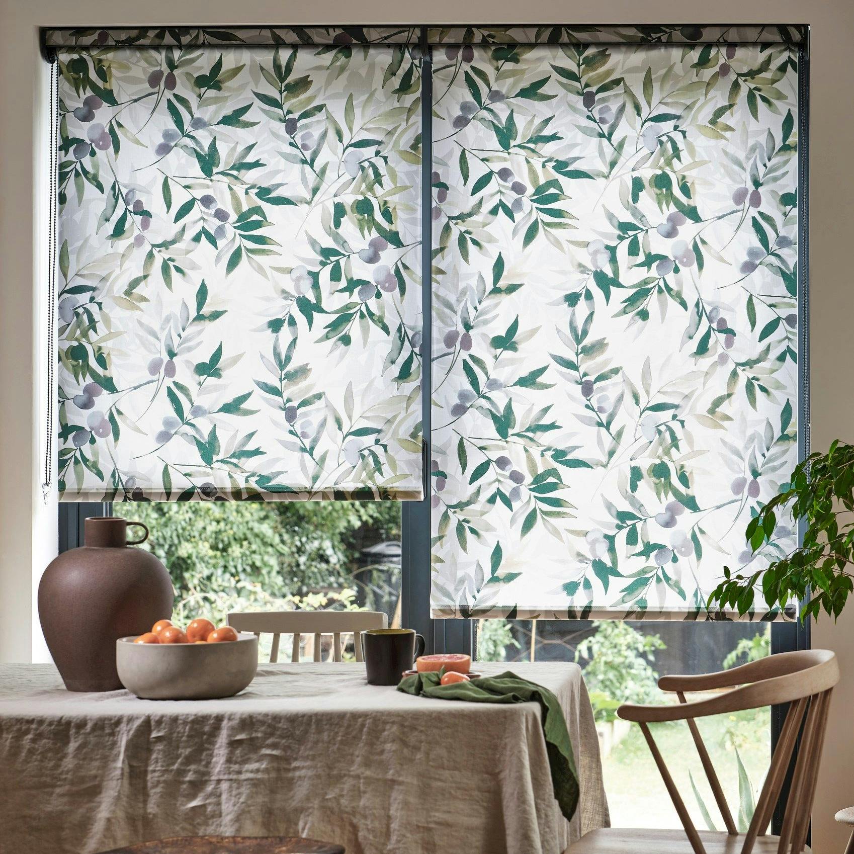 An earthy dining room with a white and green blind and fitting furnishings