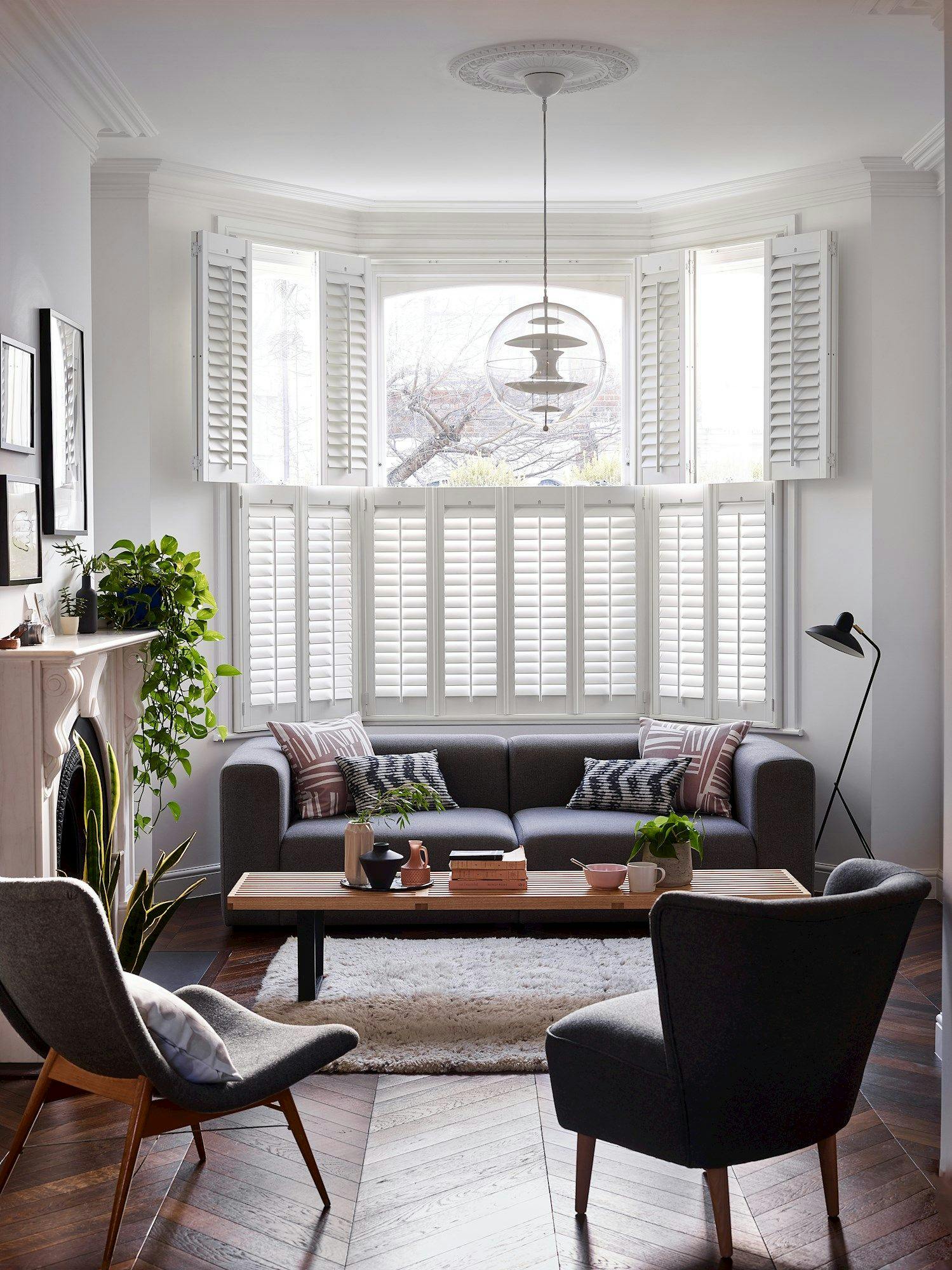 White tier on tier shutters in a modern living room