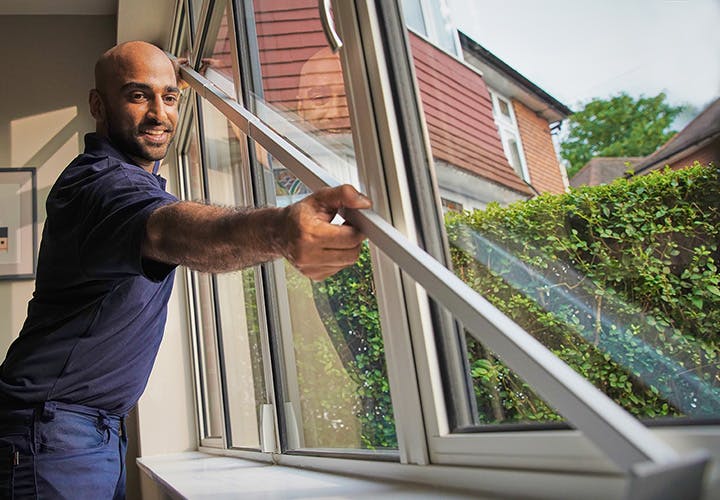Advisor fitting blinds over large windows