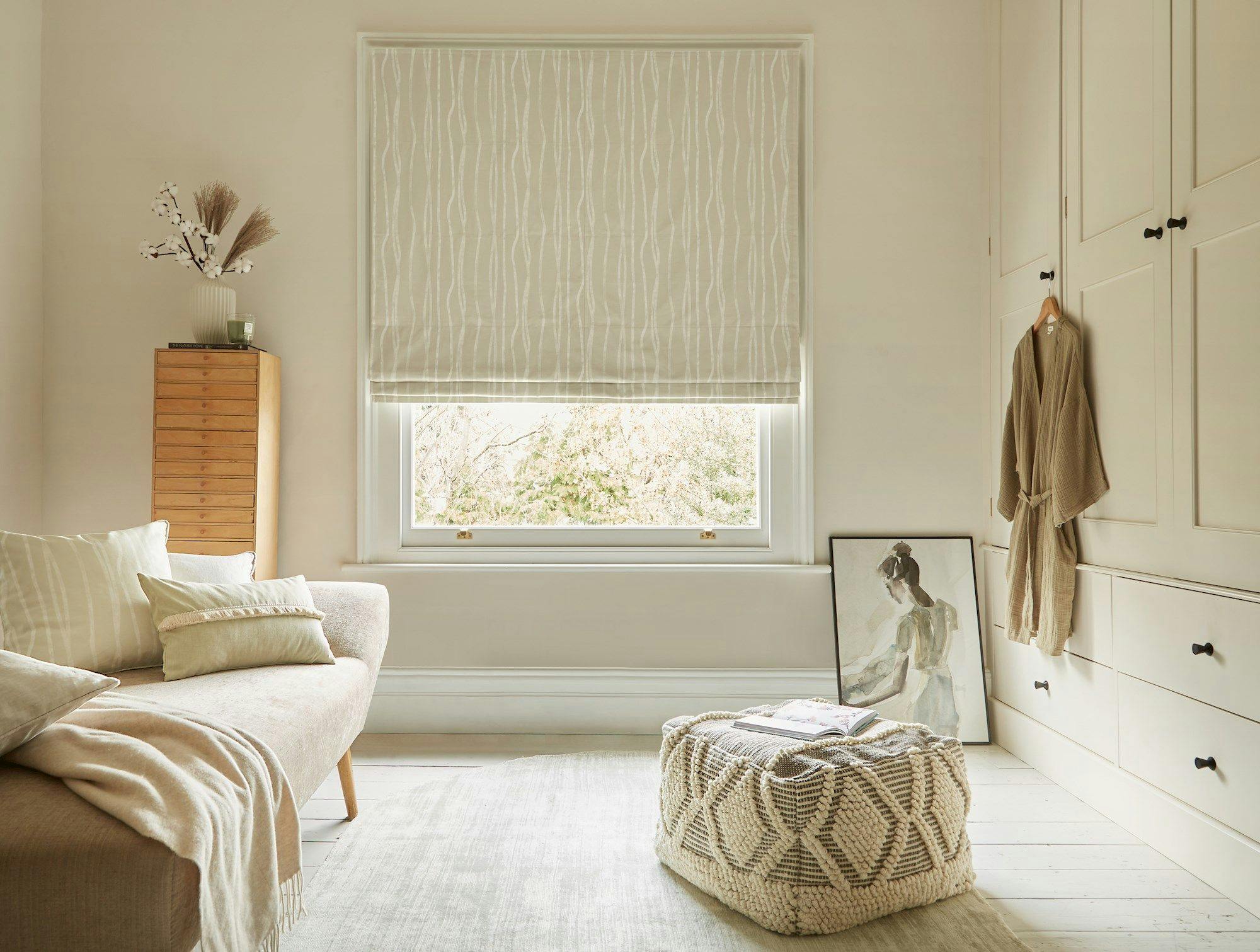 Flow Sesame roman blind in a dressing room window 