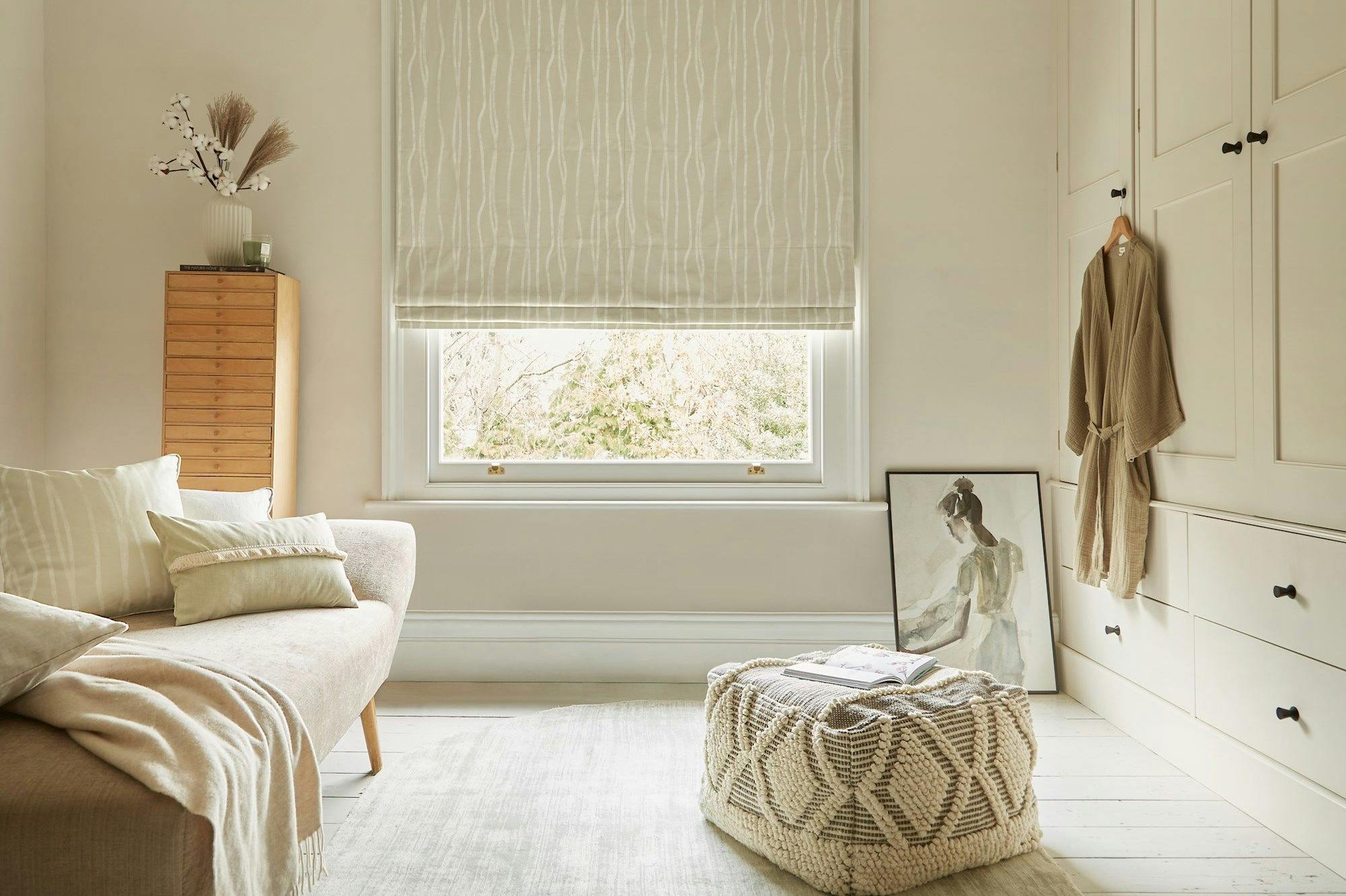 Flow Sesame roman blind in a dressing room window