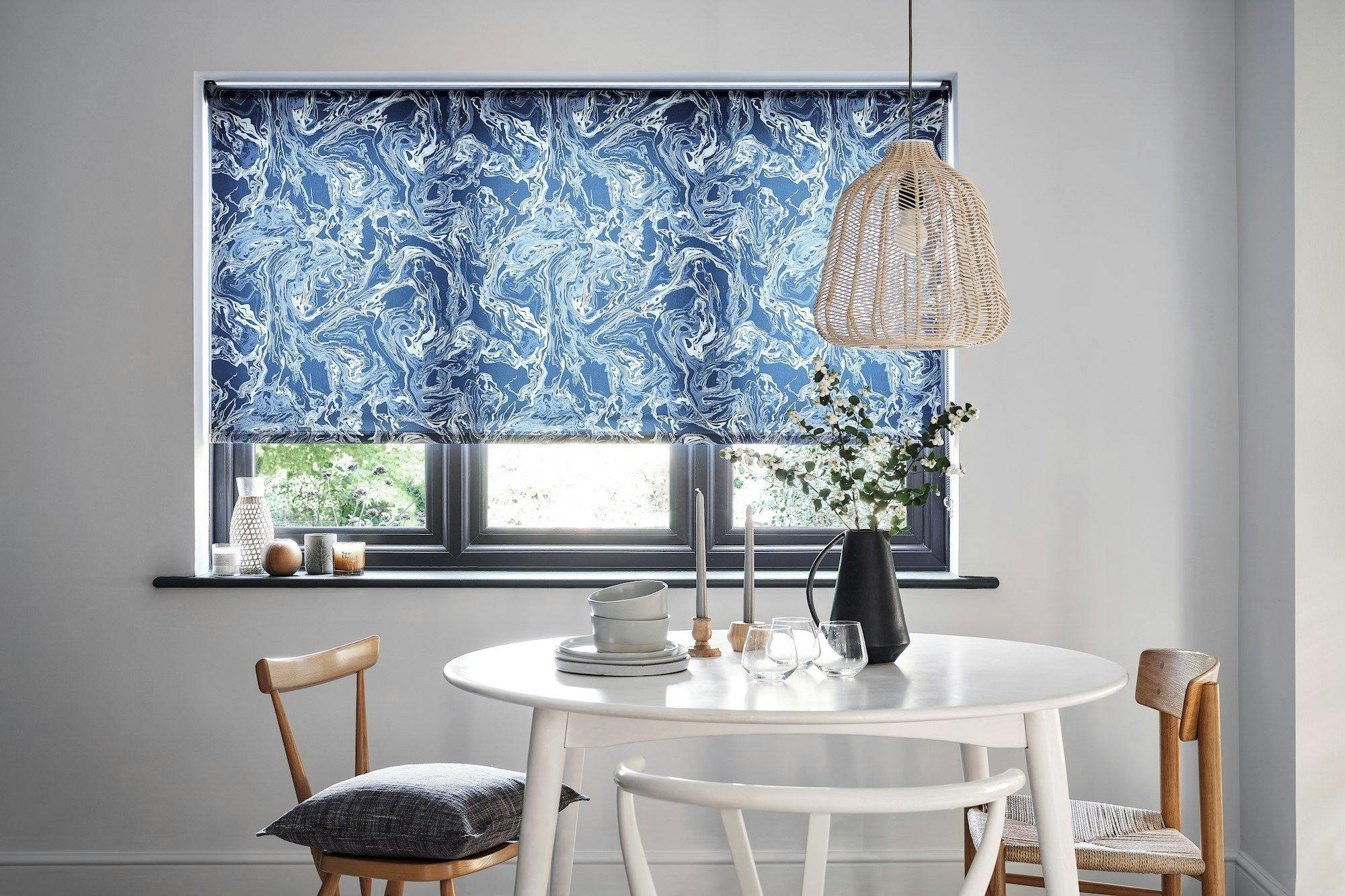 Marble Aquamarine Roller Blind in a dining room with a table and chairs 