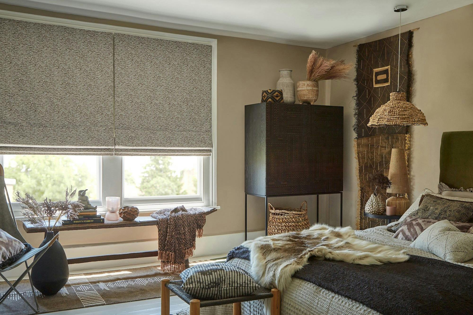 Nola camo roman blinds in cosy rustic bedroom